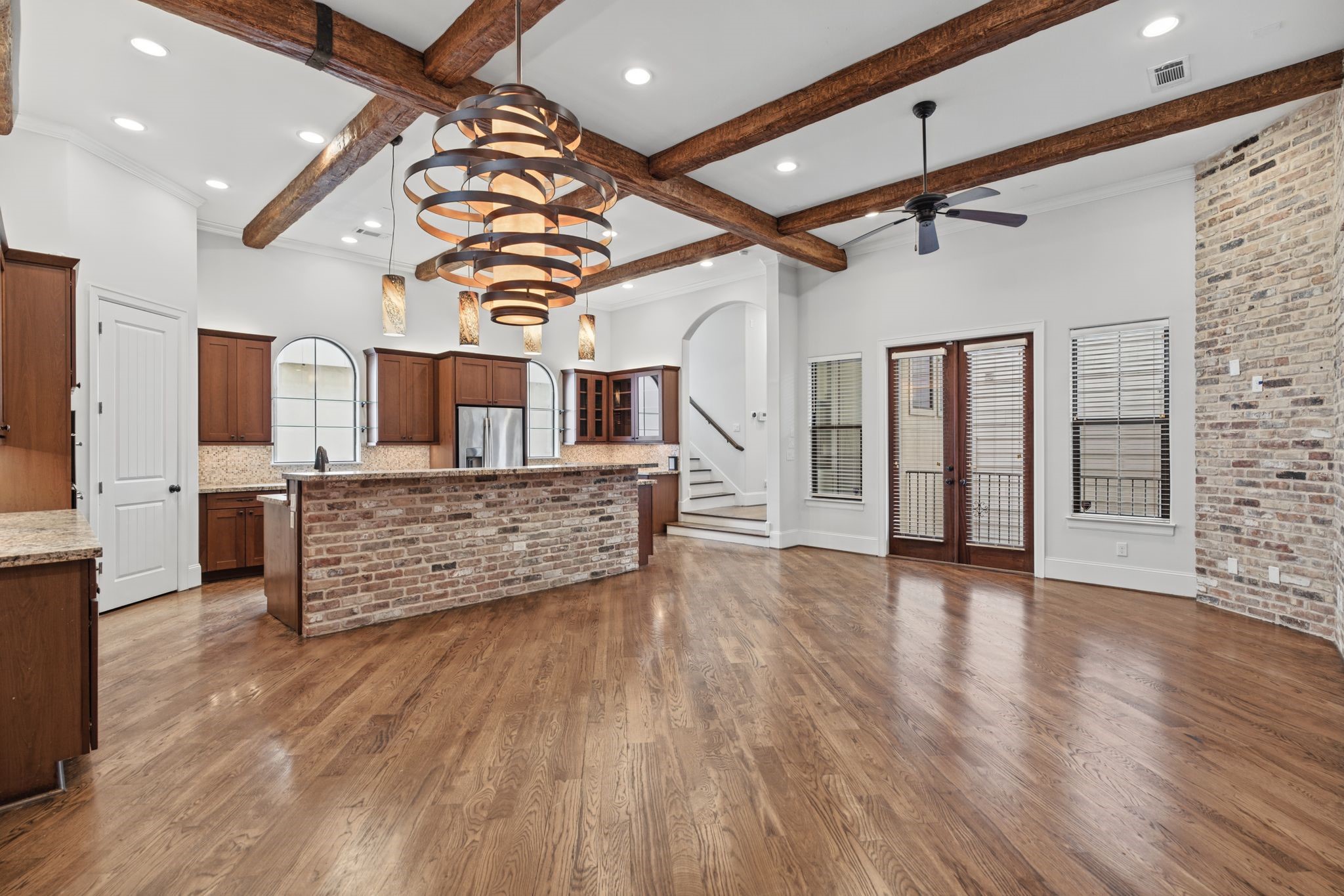 Second Floor | Open-Concept Living  A beautiful interplay of architectural character and effortless livability, the second floor brings together the living, dining, and kitchen spaces in one inviting setting.