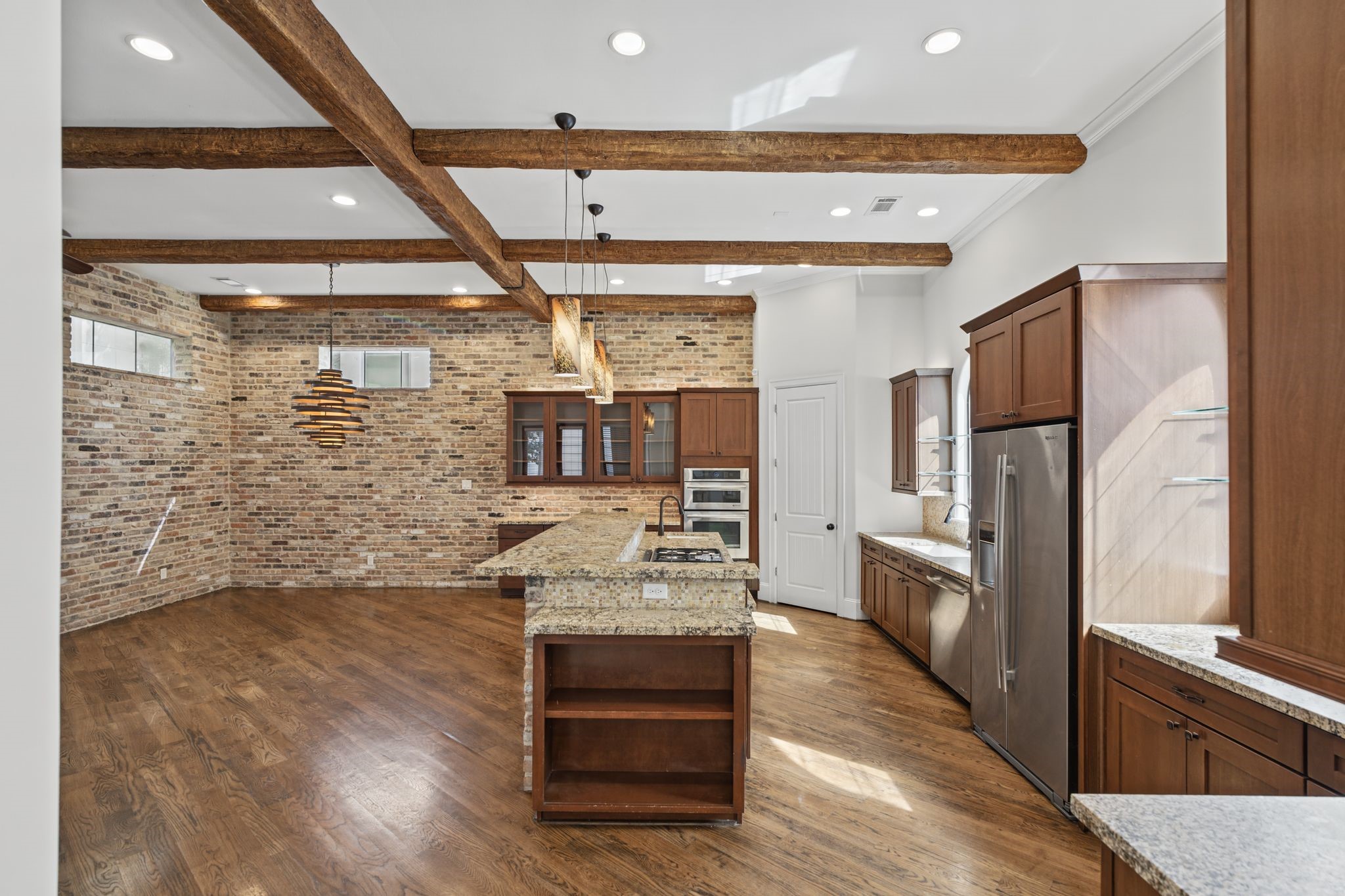 Second Floor | Open-Concept Living  A beautiful interplay of architectural character and effortless livability, the second floor brings together the living, dining, and kitchen spaces in one inviting setting.