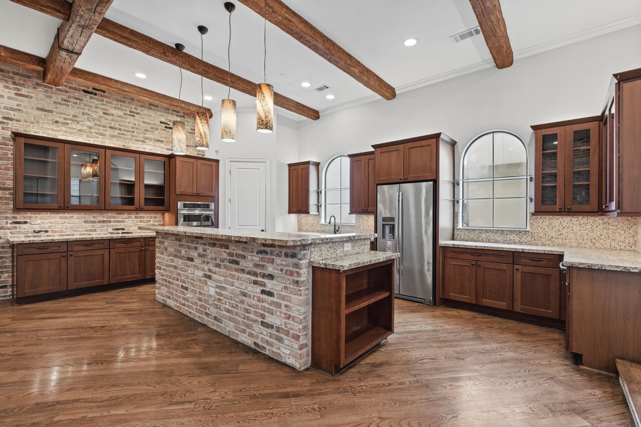 Kitchen | Breakfast Bar  Second Floor  A welcoming extension of the kitchen island, this elevated breakfast bar offers the perfect perch for morning coffee, casual dining, or conversation with the chef.