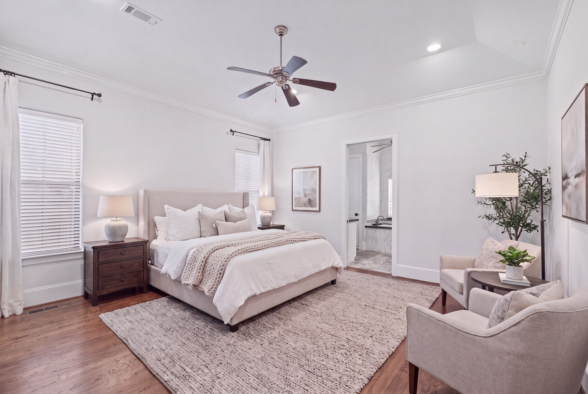 Primary Bedroom [15 x 16]  Third Floor. A peaceful retreat above the homes gathering spaces, the primary suite offers generous proportions, a spacious walk-in closet, and access to a private balcony overlooking the courtyard. An inviting place to begin and end each day. Disclaimer: This image has been virtually staged.