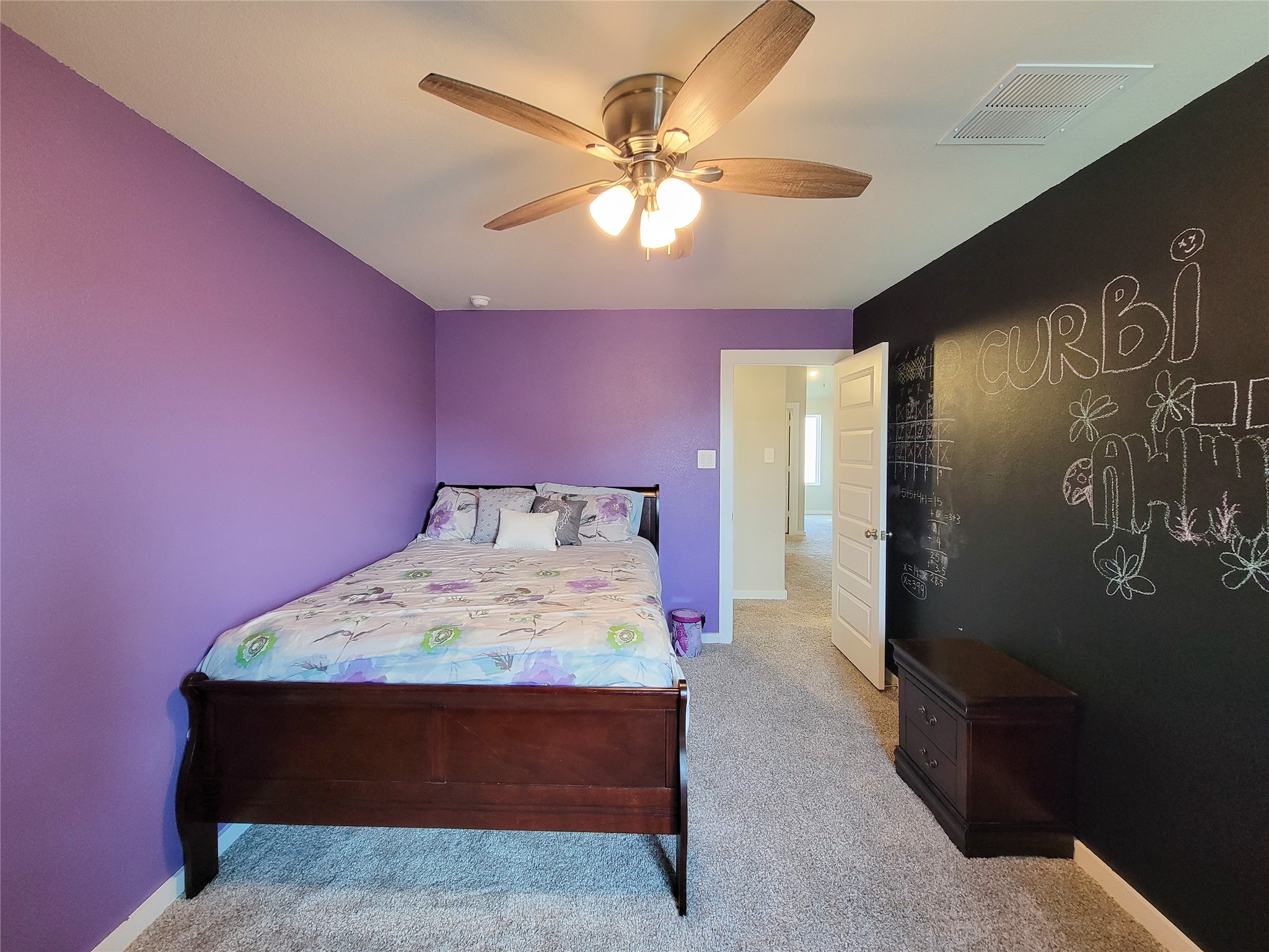 Bedroom 3 with a fun chalkboard paint wall