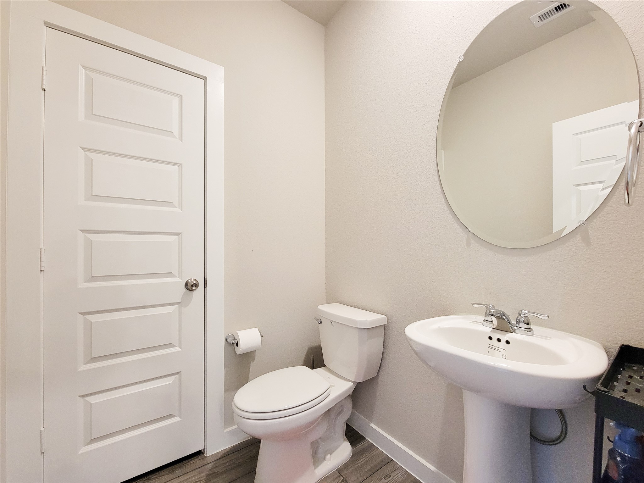 half bathroom on the fist floor across from the kitchen