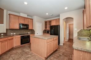 Kitchen with an island and ample storage