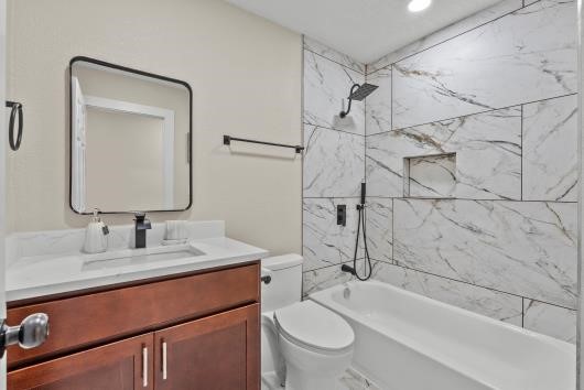 Primary bath, features quartz counters, new cabinets, updated shower and soaking tub,.