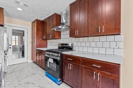 All new appliances including gas stove, refrigerator, dishwasher, and modern tyle flooring highlight this large kitchen, All new appliances including gas stove, refrigerator, dishwasher, and modern tyle flooring highlight this large kitchen,