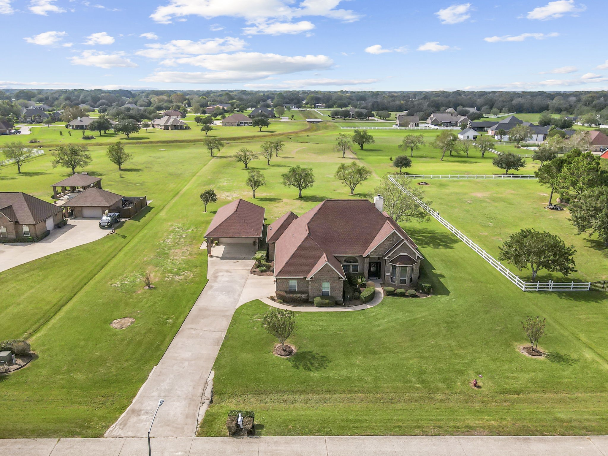 Writing





Beautiful aerial view showcasing this brick home situated on over 2 acres of beautifully maintained grounds. Featuring a long driveway, detached garage, mature trees, and expansive green space, this property offers plenty of room to enjoy outdoor living and make it your own.