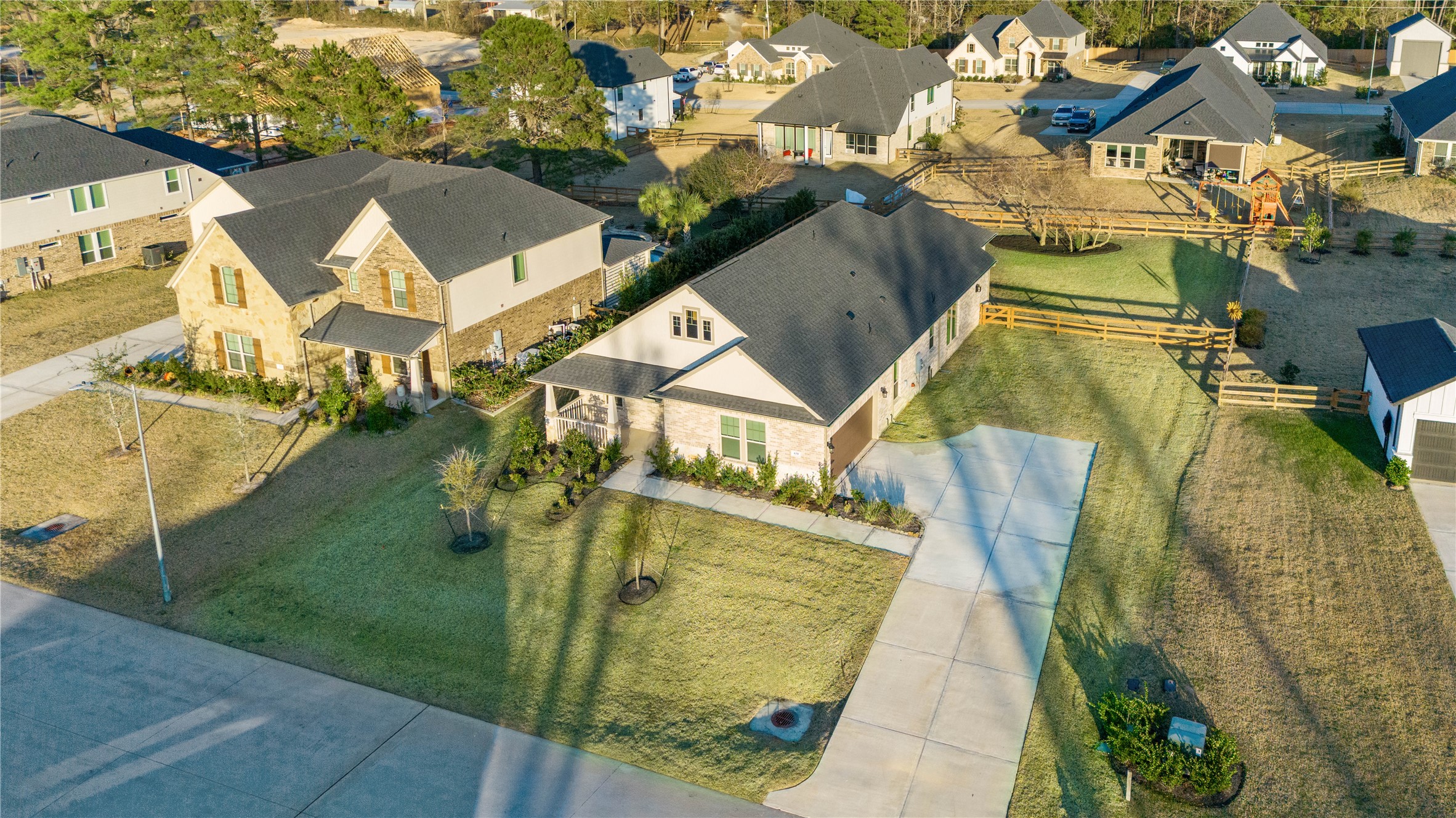 Timber Hollow is a charming community nestled among mature oak trees in Magnolia, Texas, blending natural beauty with modern living. Residents can enjoy a peaceful lifestyle with a scenic community lake and winding walking trails, perfect for outdoor enjoyment and connecting with nature.