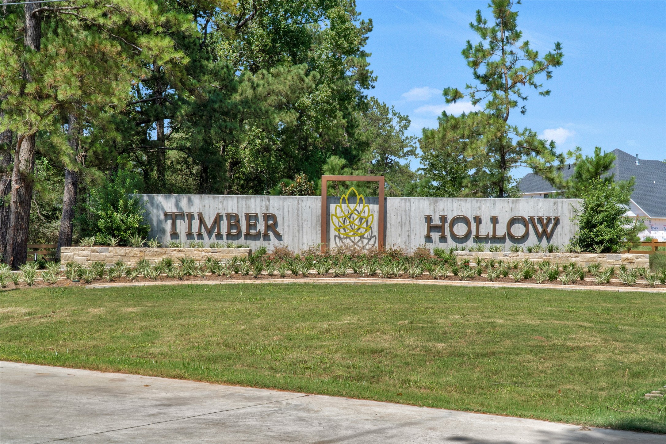 Timber Hollow is a 68-acre residential community developed by Beazer Homes in Magnolia, TX, characterized by its serene, natural landscape of mature oak trees and rolling hills.