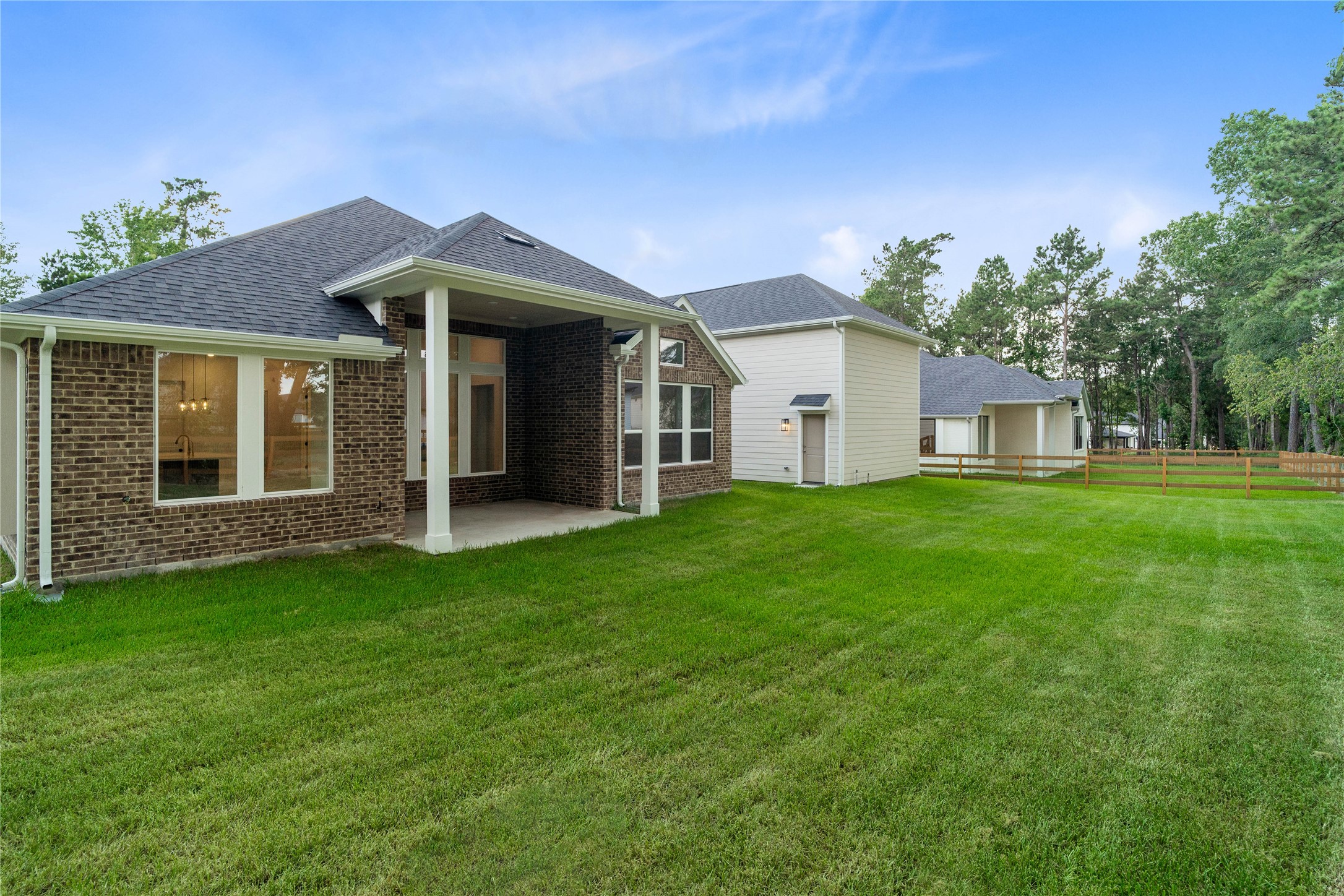 A sweeping view of the backyard offers a wide-open canvas with seamless access to the massive detached workshop.