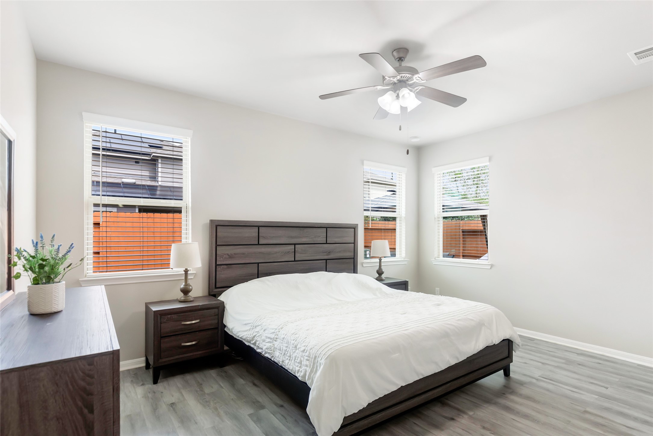 Spacious first-floor primary bedroom offers a peaceful retreat with generous room for furnishings.