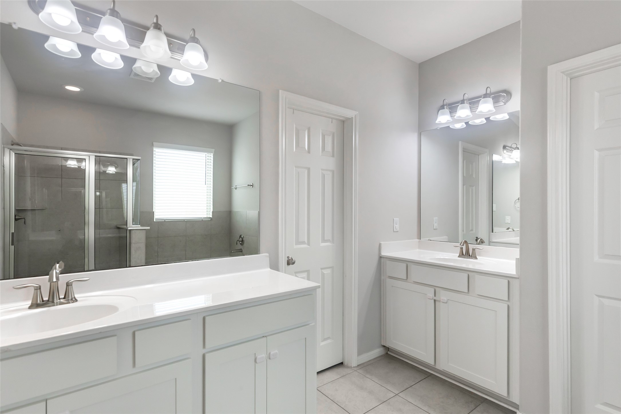 Primary bath features dual vanities, soaking tub, separate shower and ample cabinetry.