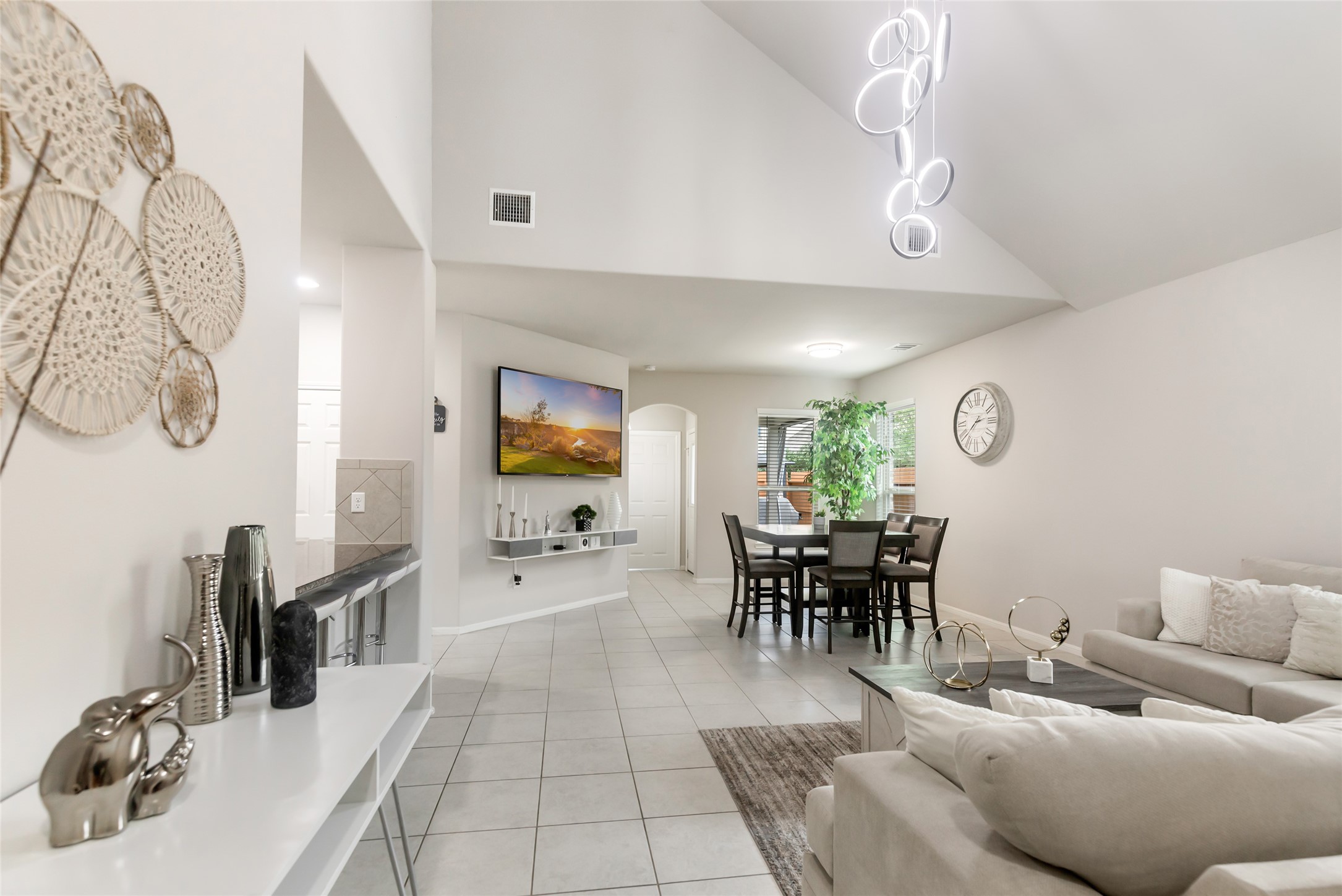 Wide-open main living space provides excellent flow between the living room, dining area and kitchen.