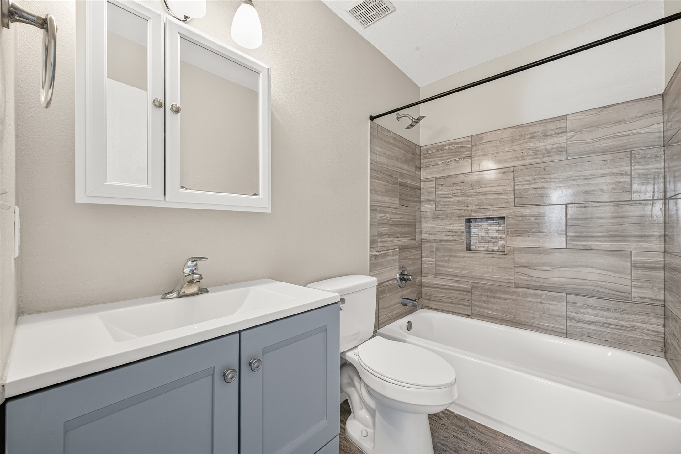 Primary bathroom features a tub/shower combo