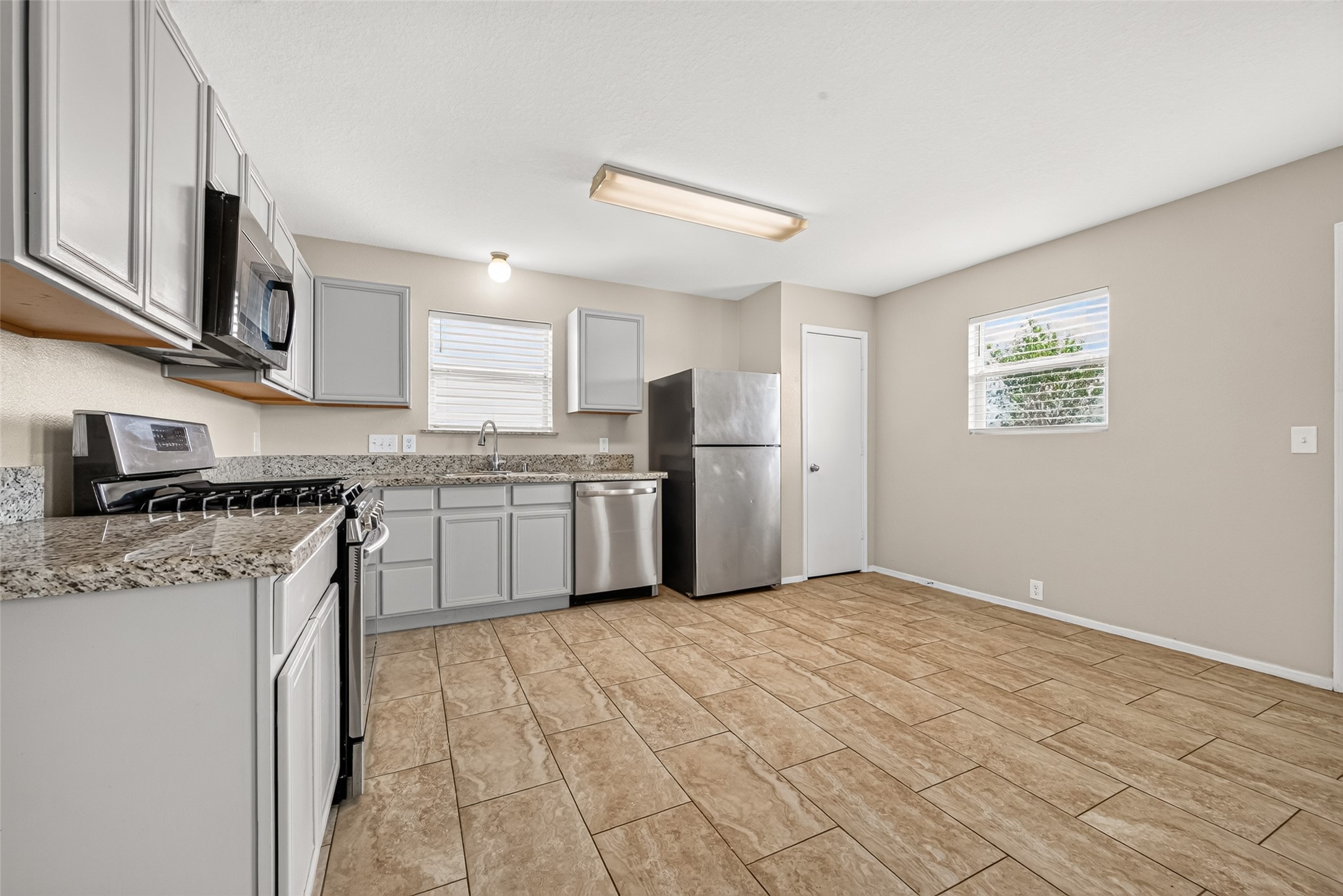 The Kitchen features ample counter space and stainless steel appliances