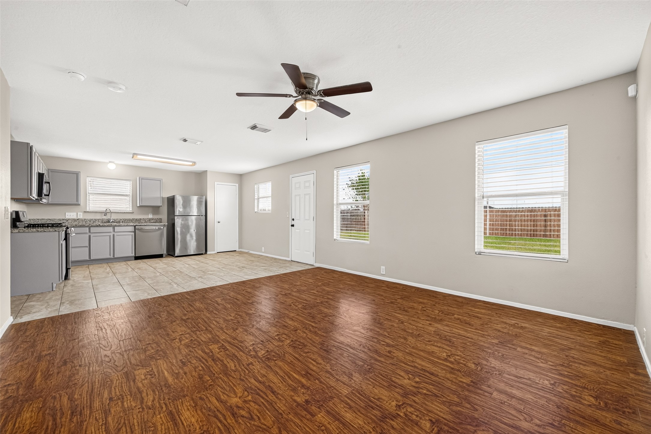 This stunning home features a spacious open-concept living area that flows seamlessly into the kitchen. With two distinct living spaces and an abundance of natural light, the home feels bright, airy, and perfect for both daily living and entertaining