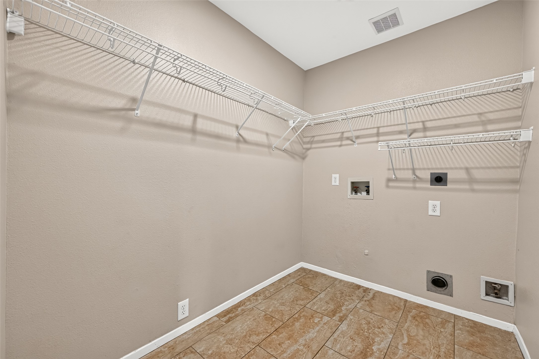 Utility room located in house with built-in shelves for extra storage