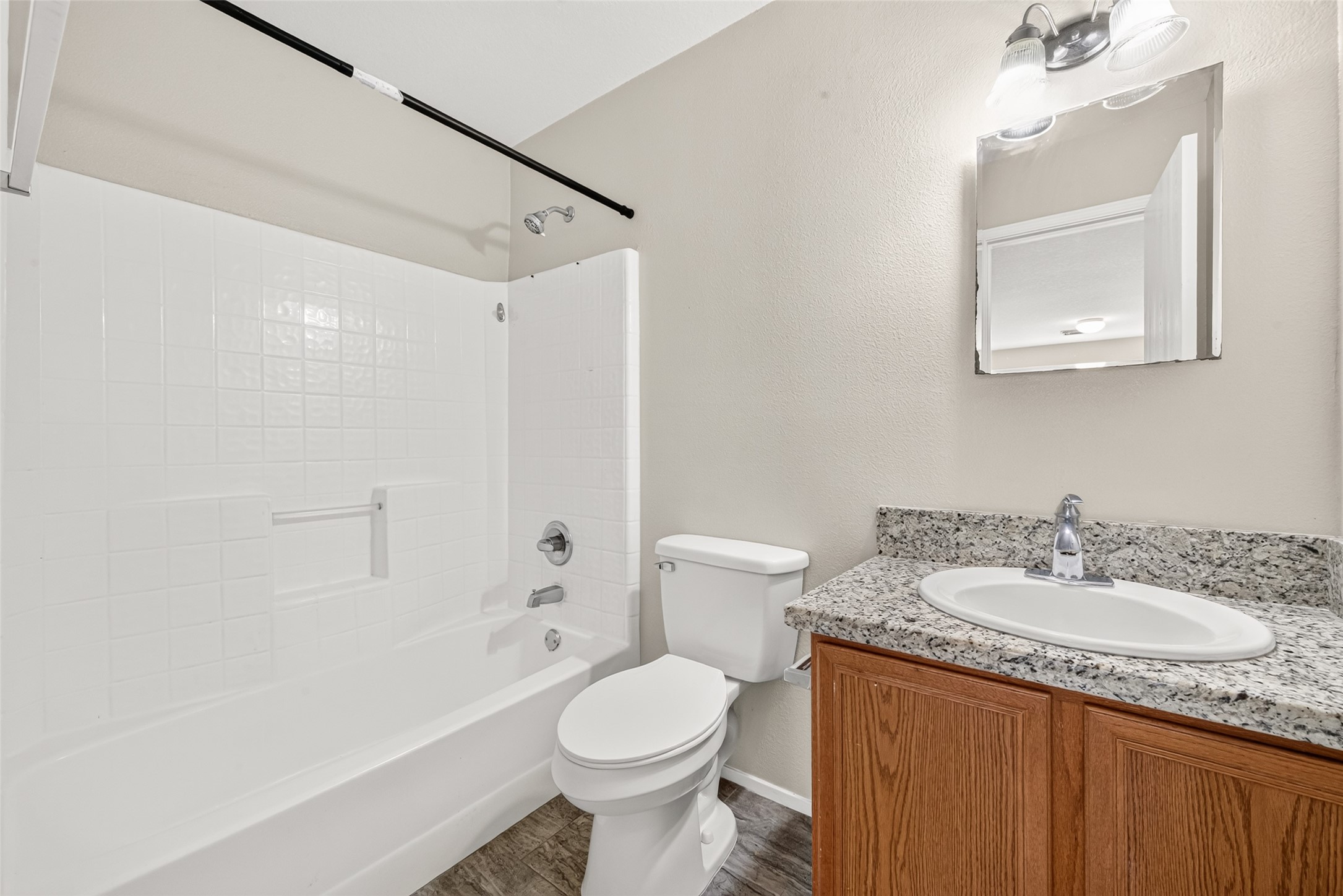 Guest bathroom features a tub/shower combo
