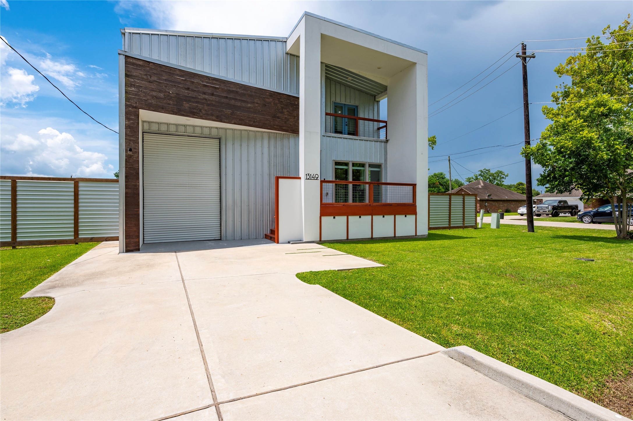 Double wide drive way leads to the garage with 12ft bay door.
