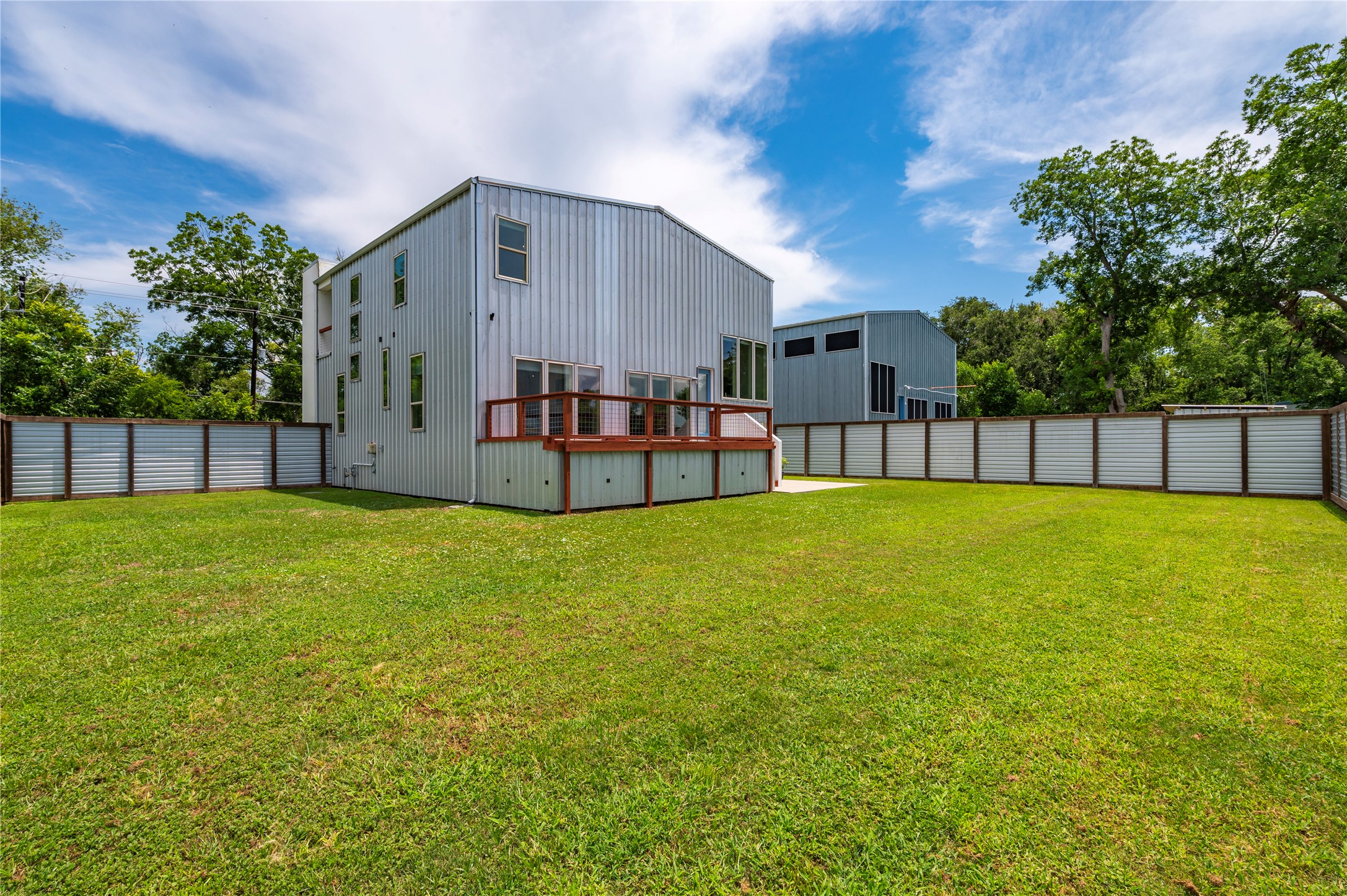 Pool size backyard on private corner lot. 8' tall fencing made from cedar, exterior pine, and metal.