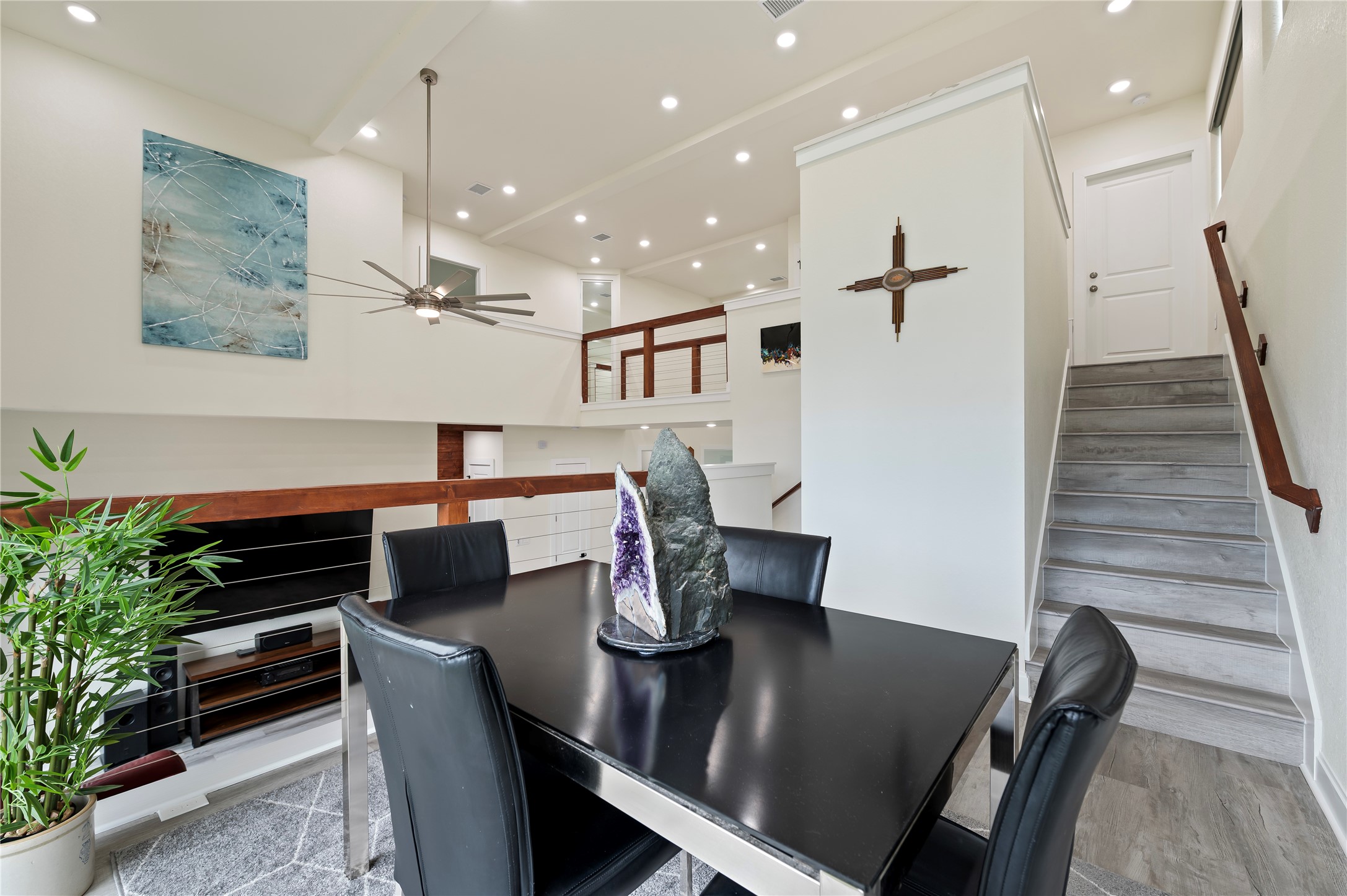 Soaring 20-foot ceilings and COREtec Pro Plus Vinyl Plank in Chesapeake Oak and LED lighting throughout.