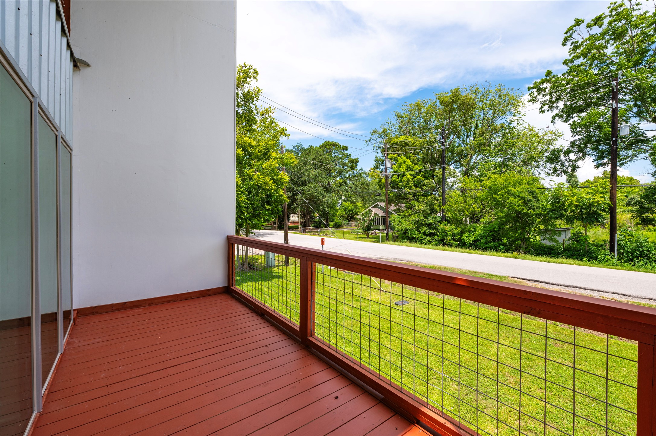 Large 2-story high covered front deck overlooks the front yard.