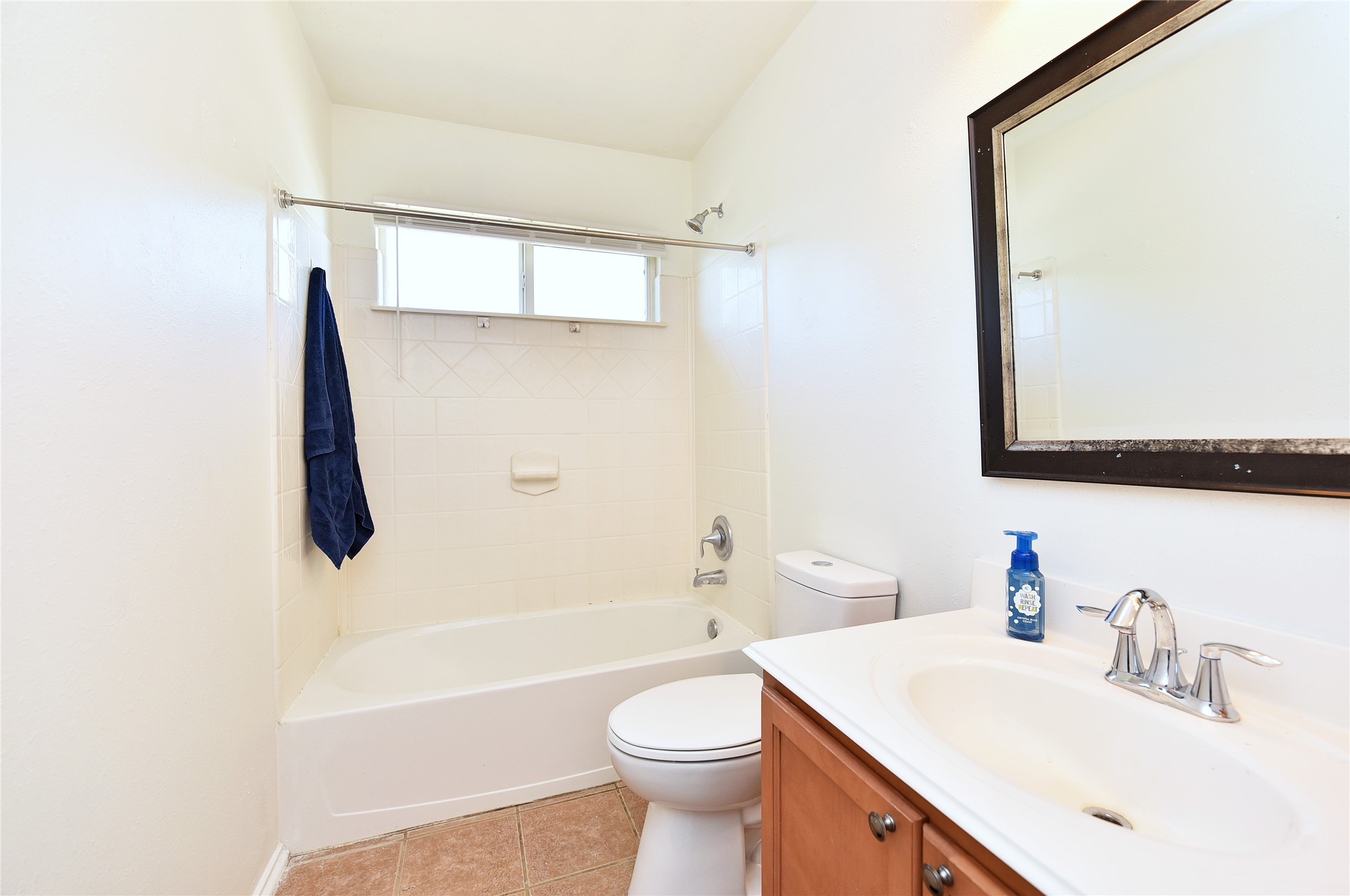 Upstairs bath with tub/shower combination.