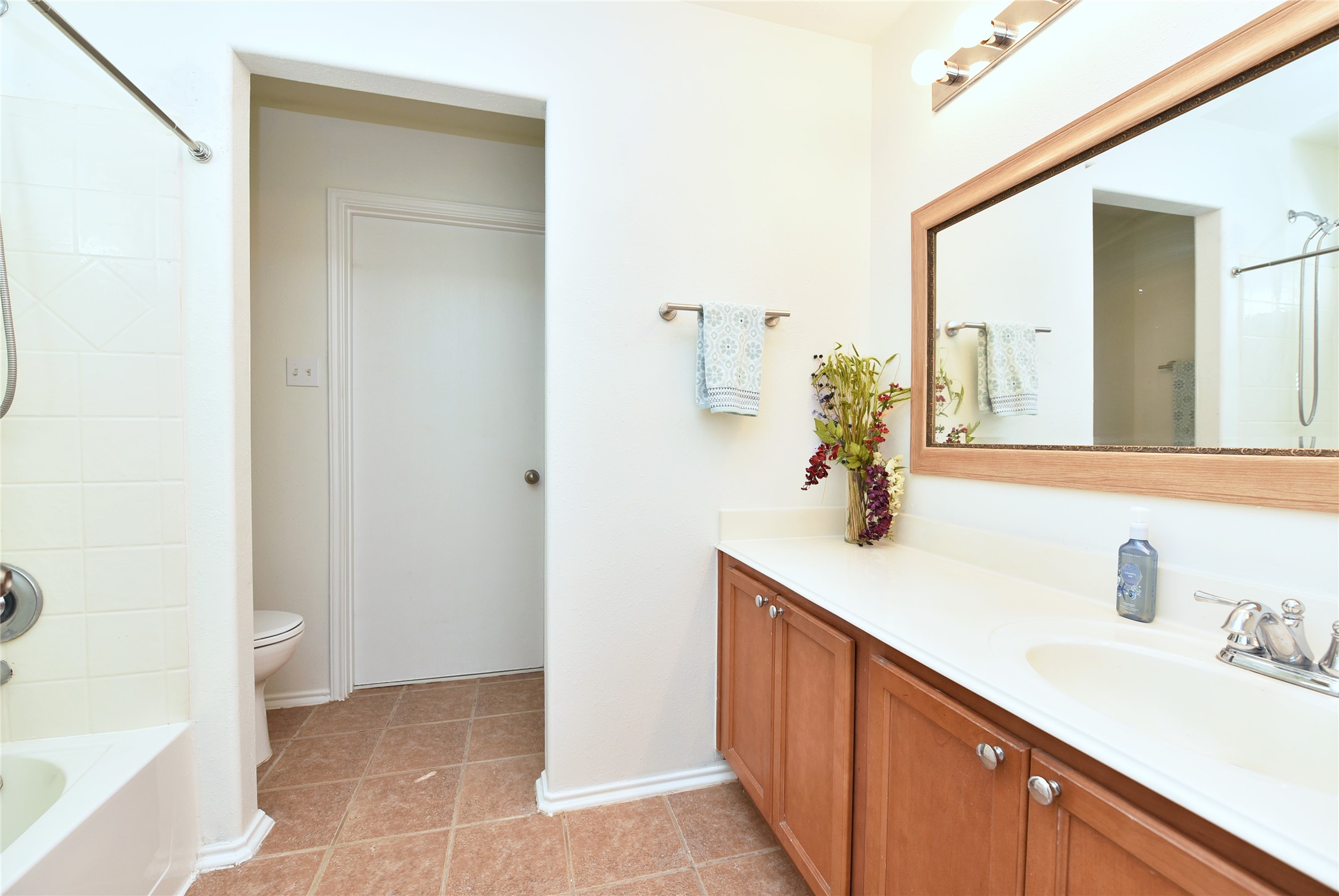 The primary bathroom has a tub/shower combination, and a large walk-in closet.