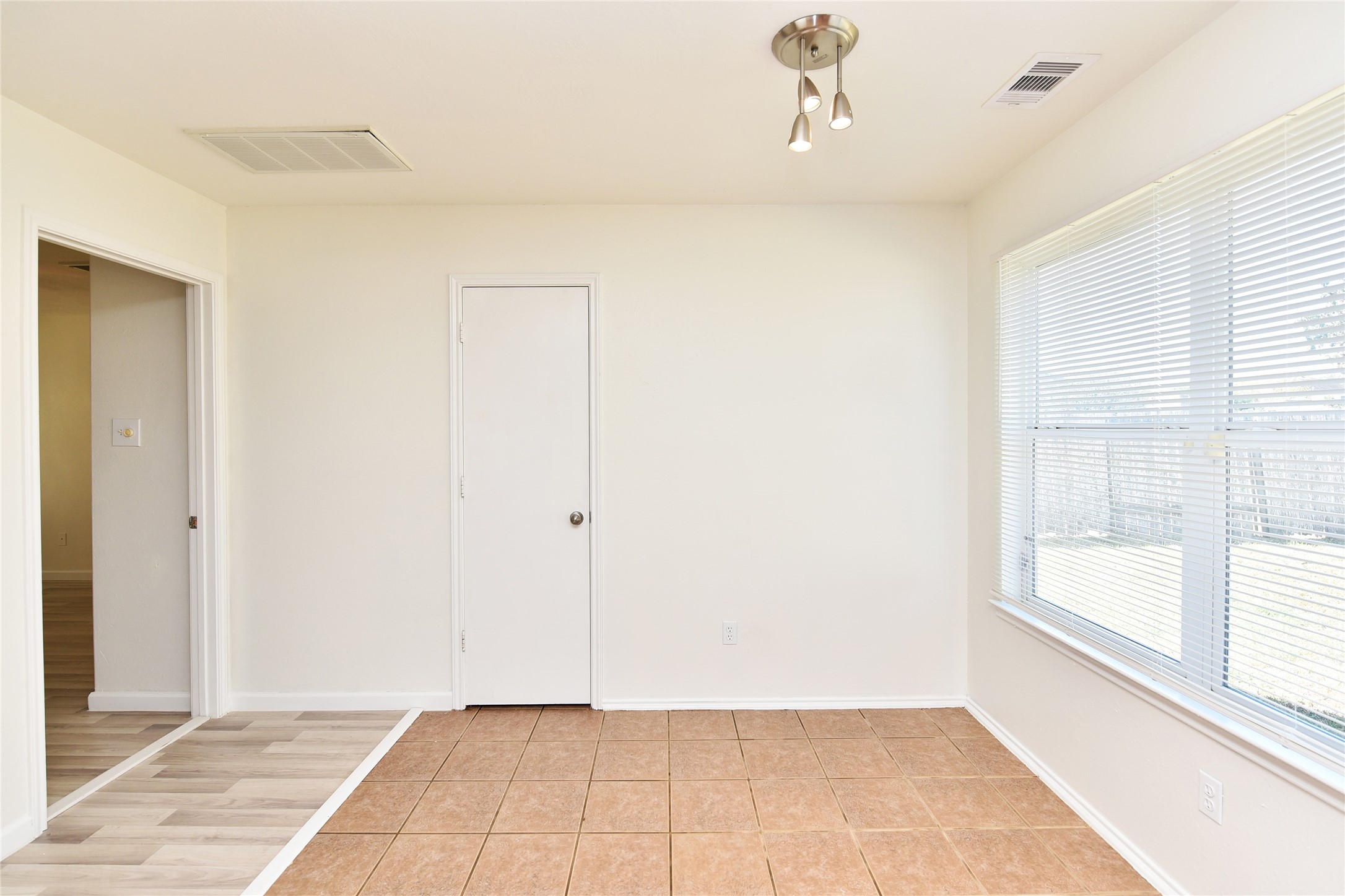 The breakfast room with great natural light from the back yard.