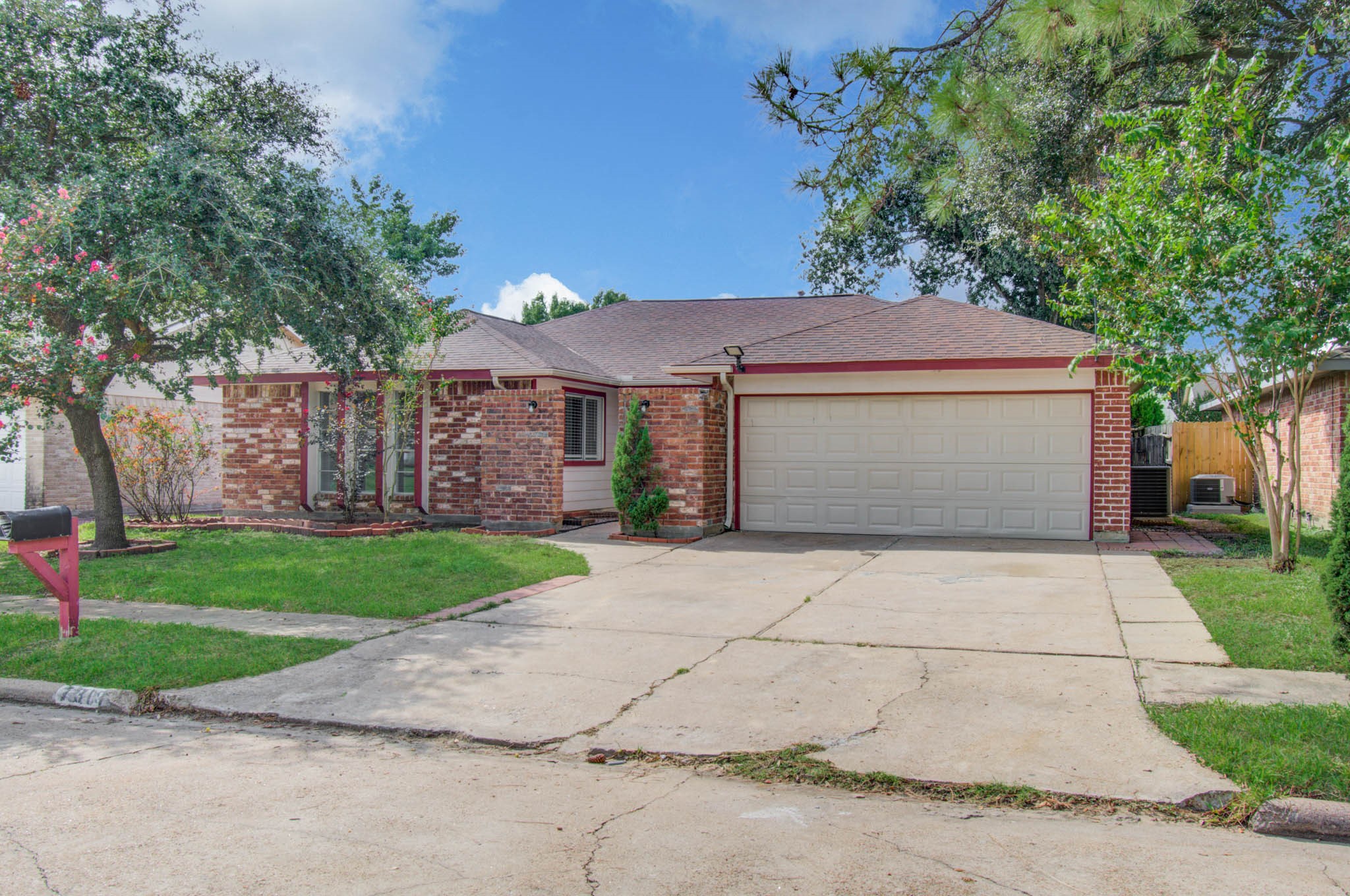 Charming brick home with a spacious two-car garage, nestled on a quiet street, featuring lush green lawns and mature trees for added curb appeal. Charming brick home with a spacious two-car garage, nestled on a quiet street, featuring lush green lawns and mature trees for added curb appeal.