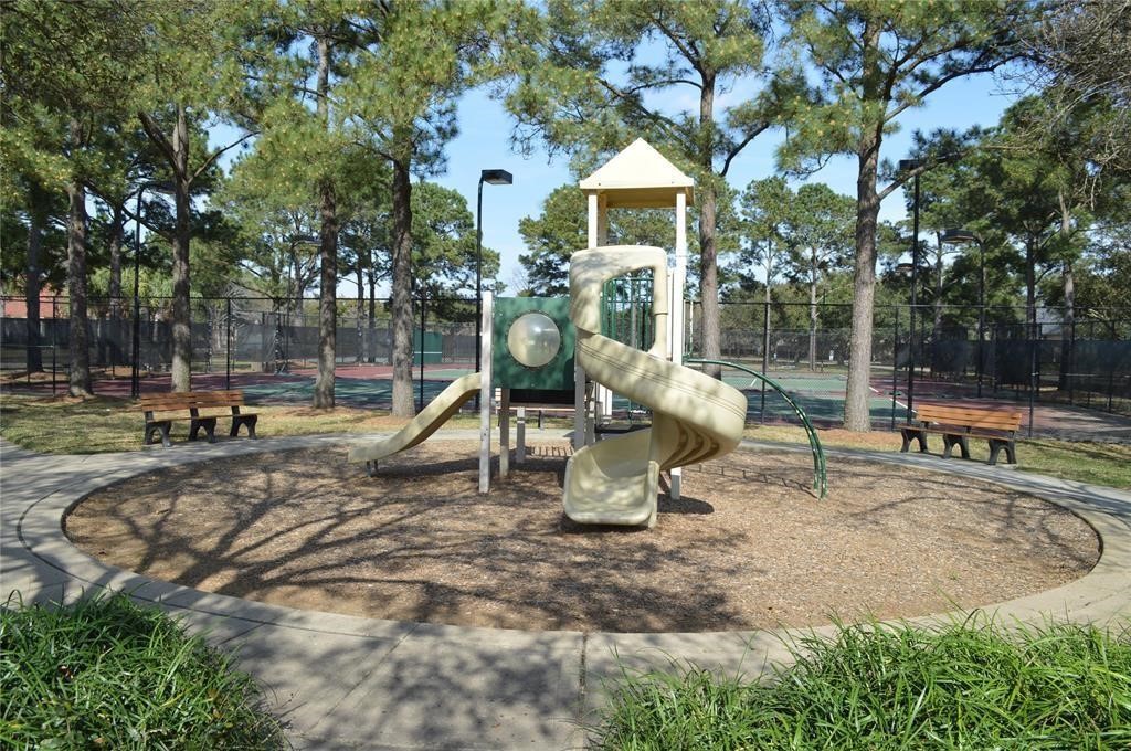 Family-friendly amenities include a playground next to the tennis courts, conveniently located near the property.