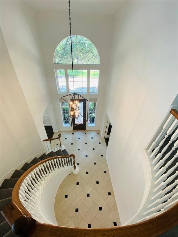 Elegant curved staircase enhances the home's grand entrance.