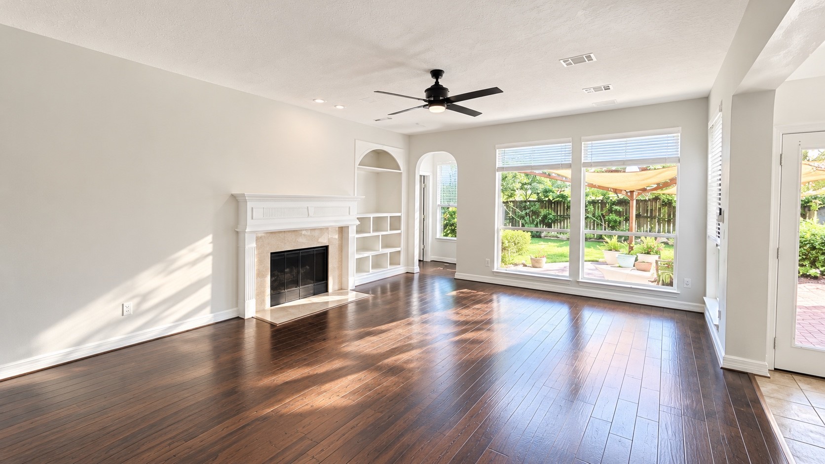 Upstairs game room featuring ample shelving for storage and display.