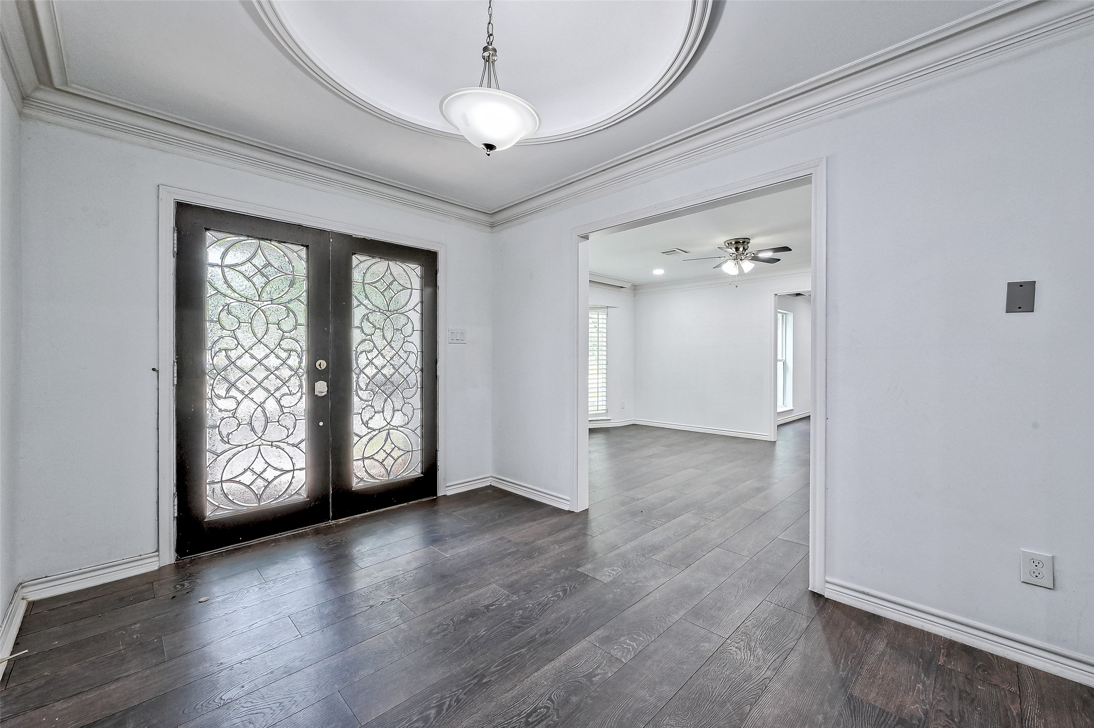 Gorgeous double doors and foyer with oval tray ceiling