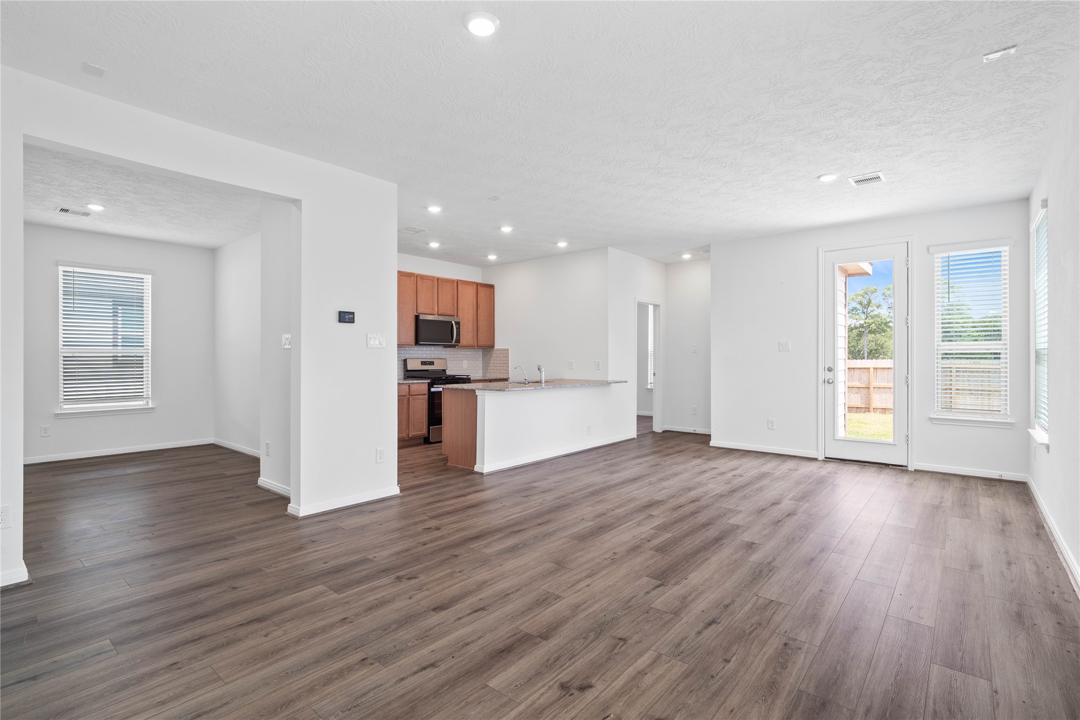 As you enter, you are greeted by the open concept living space living - the Great Room!