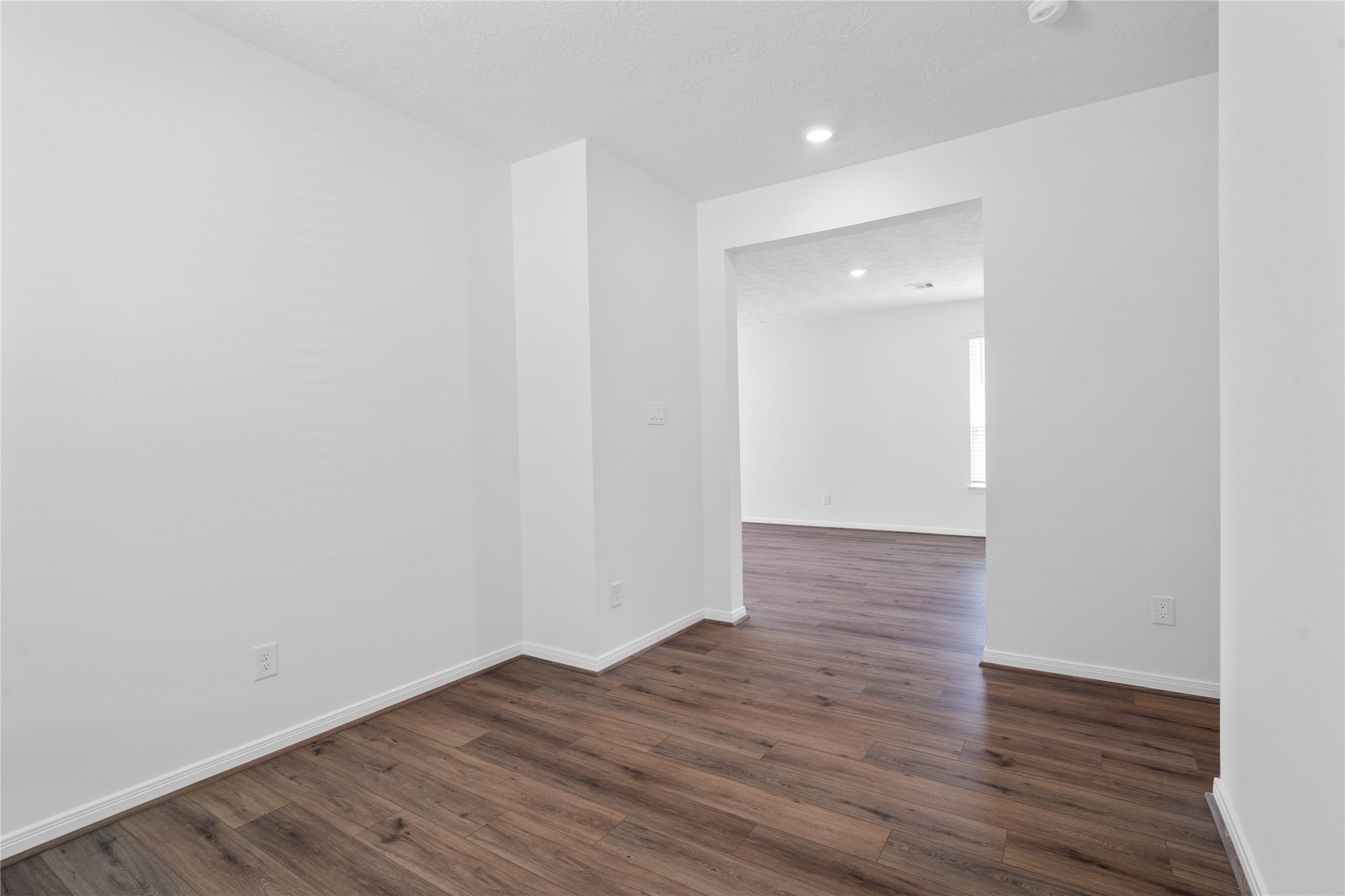 Additional view from the Den into the hallway leading to the secondary bedrooms and bathroom.