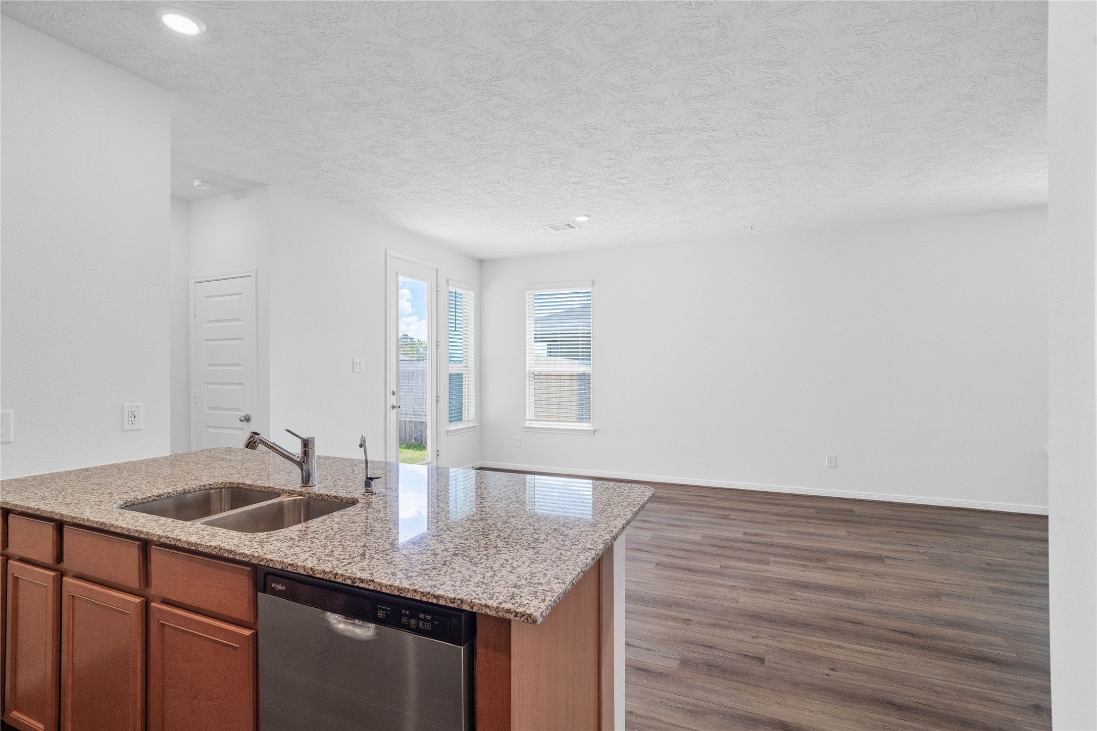 Beautiful open-concept layout effortlessly uniting the family, dining, and kitchen spacesideal for everyday comfort and entertaining guests!