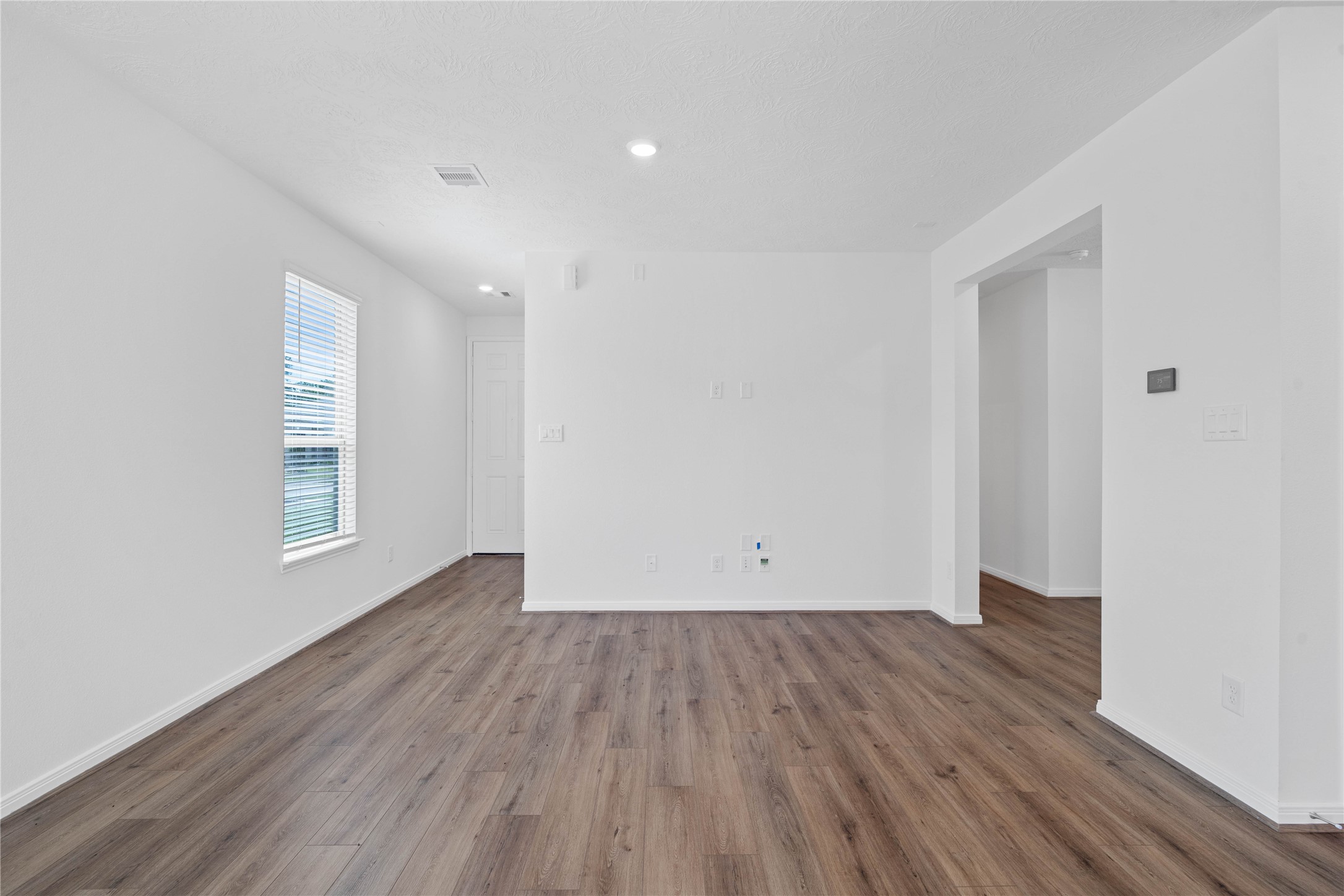 Welcome to your new home at 640 Appaloosa Meadow Drive. You are greeted with Layton Lake vinyl plank flooring in Wild Dunes, custom paint, and recessed lighting.