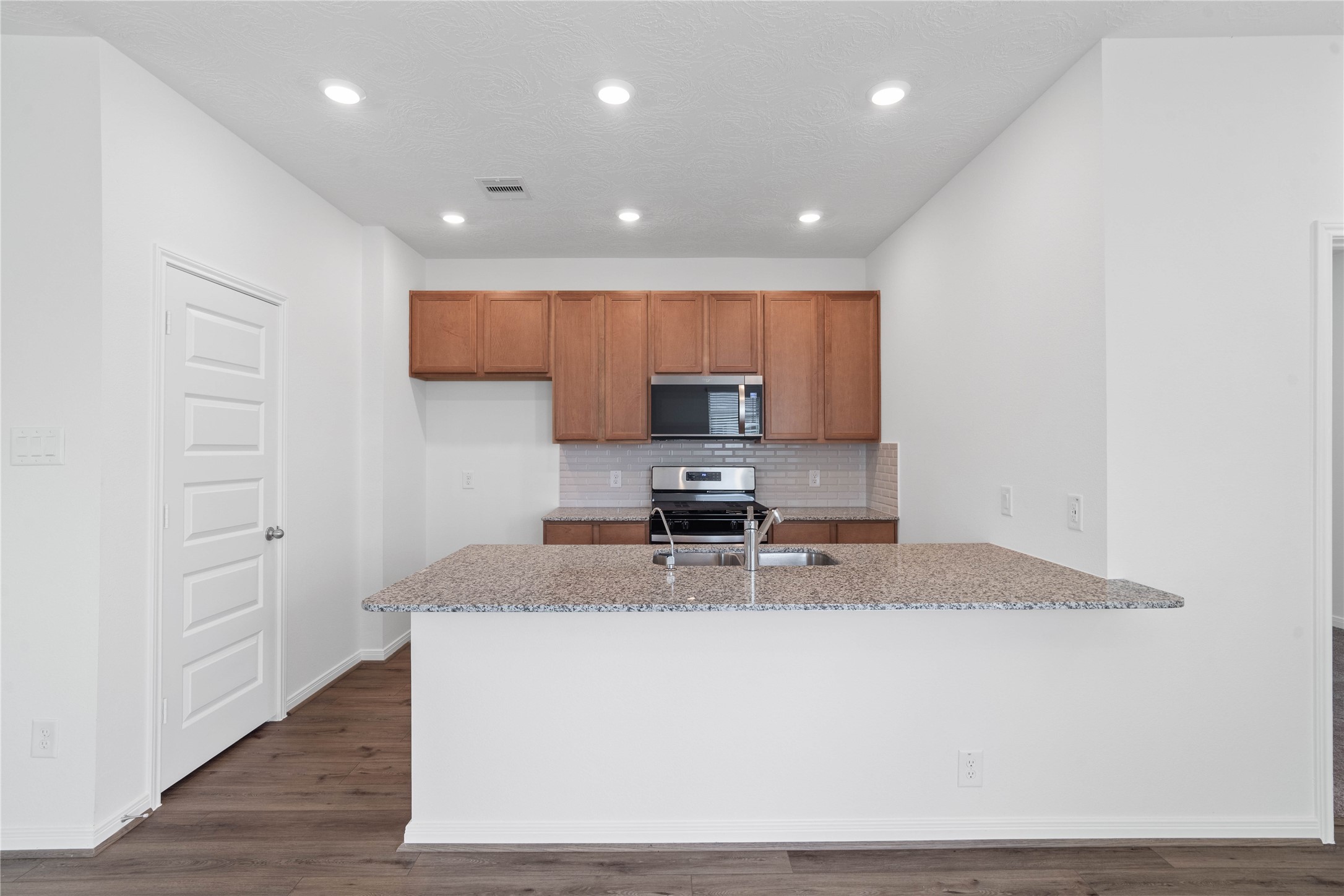 This spacious kitchen has it allample storage, generous counter space, and a layout that truly makes it the heart of the home.