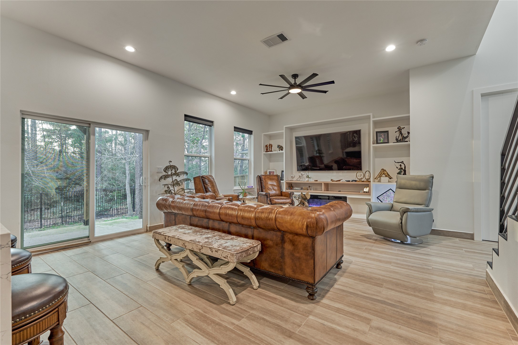 Sliding doors lead to the patio, creating effortless indoor-outdoor entertaining.