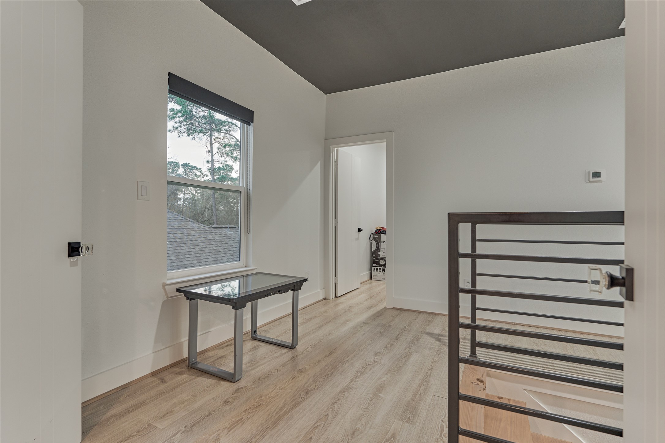 The staircase opens to a bright upstairs landing and hallway that comfortably connects the surrounding bedrooms and living spaces.