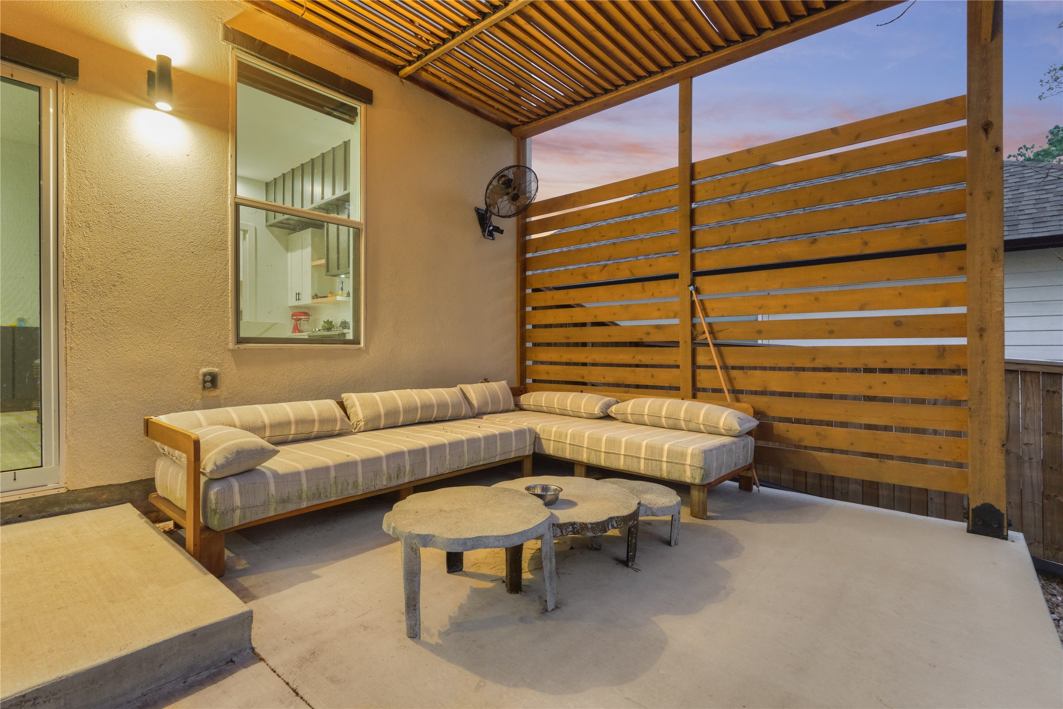 Enjoy your morning coffee on the pergola-covered back patio - perfect for al fresco breakfasts or quiet reading.