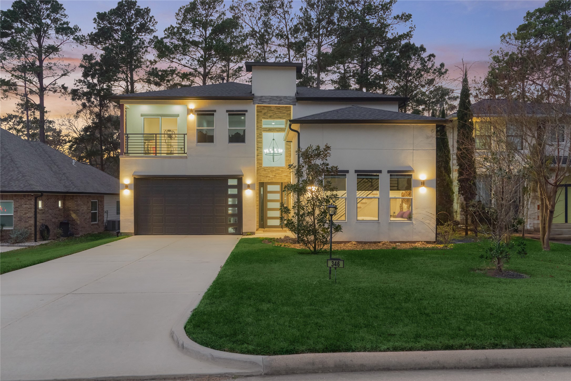 The long double-car driveway offers ample guest parking, leading to a spacious 2-car garage.
