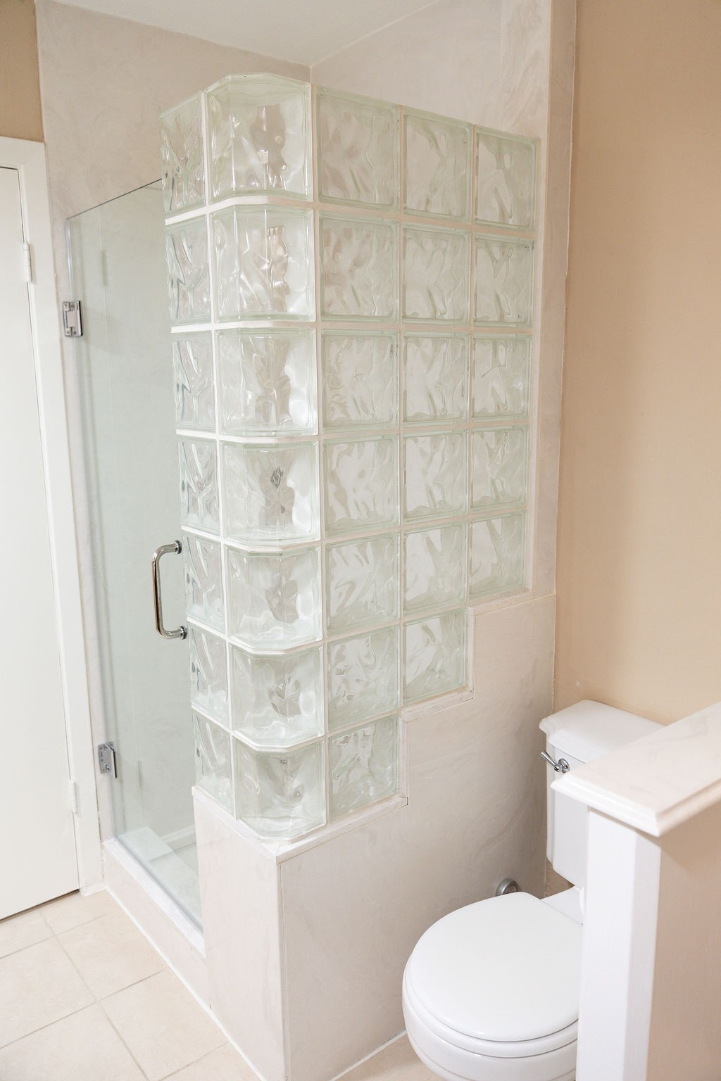 The downstairs bathroom features a spacious walk-in shower with plenty of elbow room, providing both comfort and style. Thoughtfully designed, it offers a modern, open feel that's perfect for guests or everyday use.