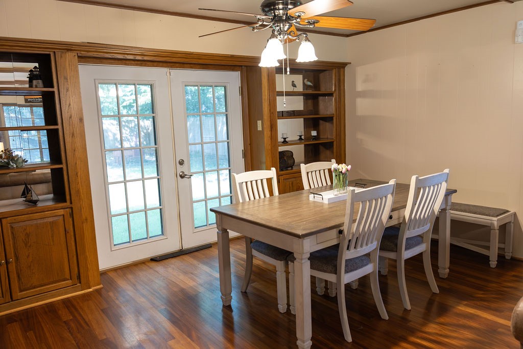 The elegant dining room is enhanced by custom built-ins that add both style and functionality, creating a warm, sophisticated space that's perfect for everyday meals, holiday dinners, and special occasions.