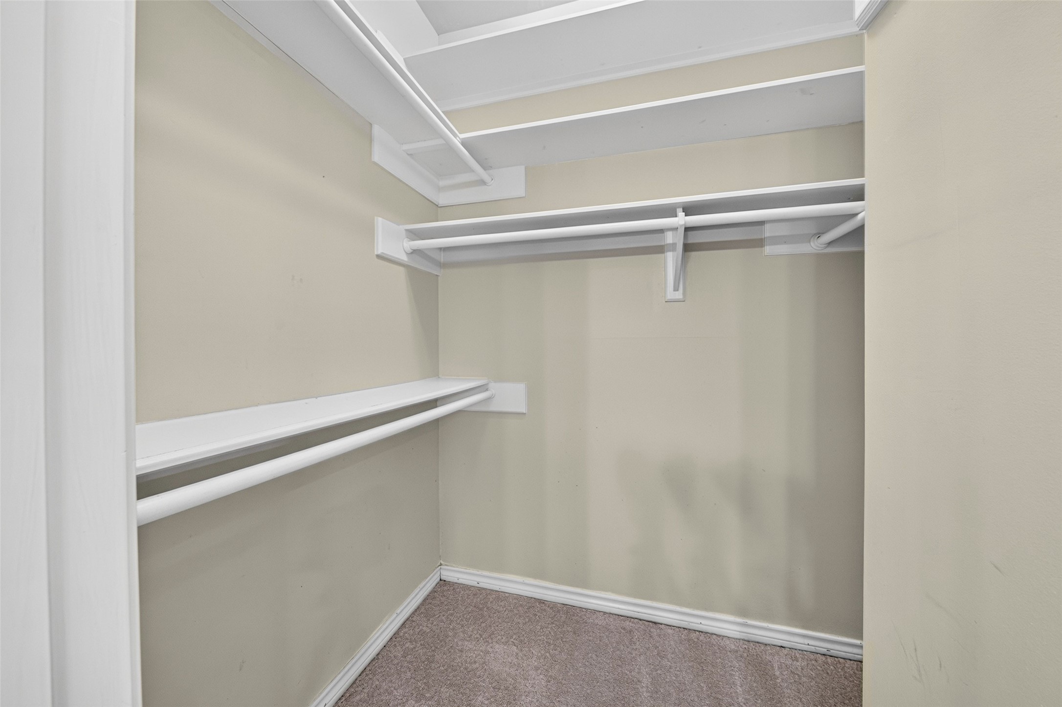 You love having two spacious walk-in closets as well as built in cabinets in the primary bathroom.