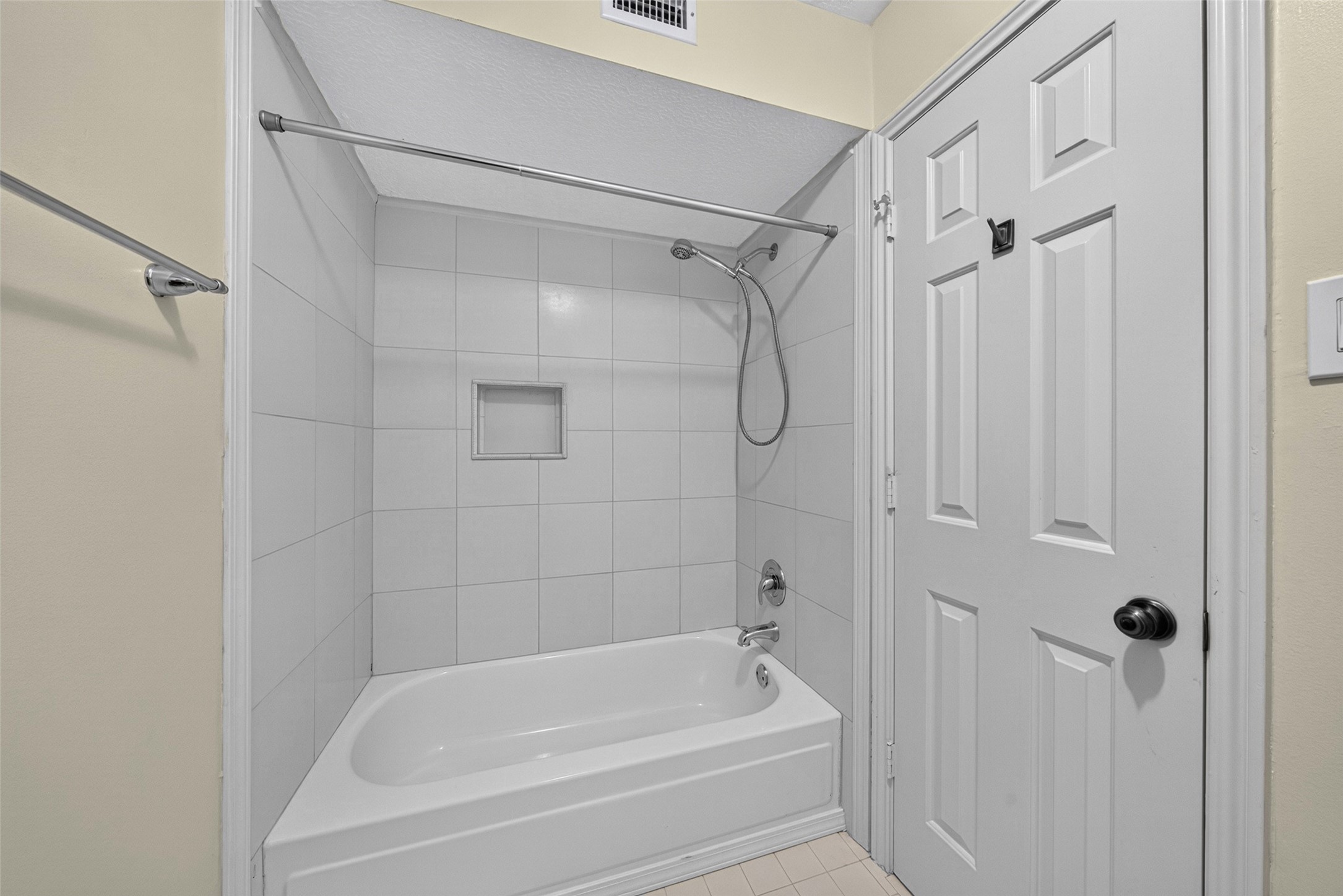 Behind a separate door you'll find a shower/tub combination and the lavatory.