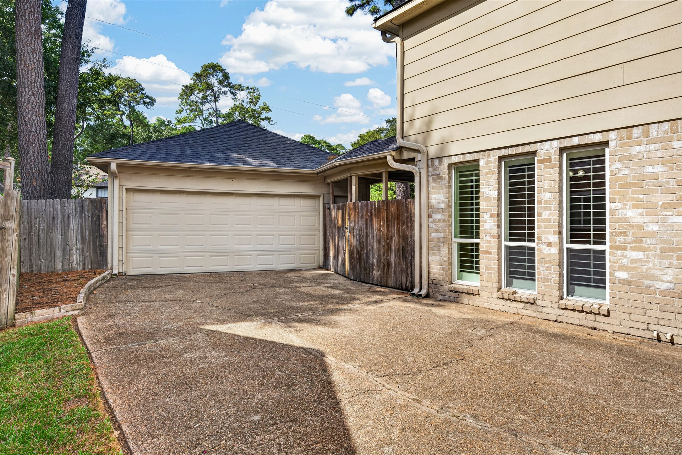 The long driveway is a perfect extra space for the kiddos to play, or for your home projects and leads to a two-car detached garage.