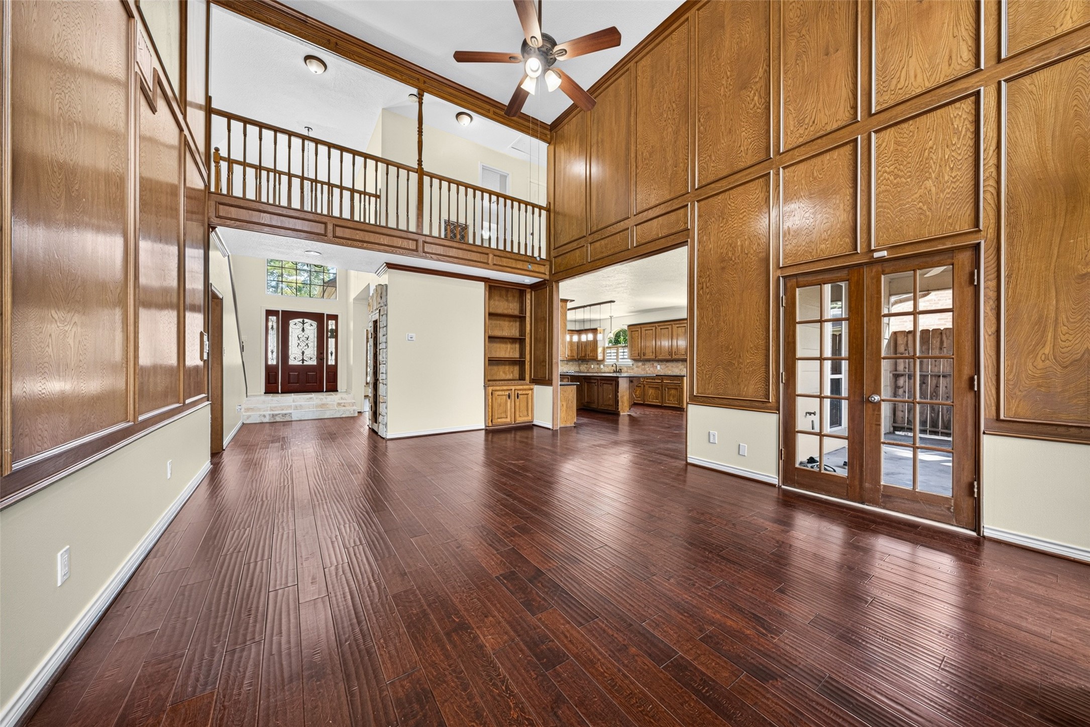 This angle of the living room highlights the cat walk balcony that connects the upstairs bedrooms.