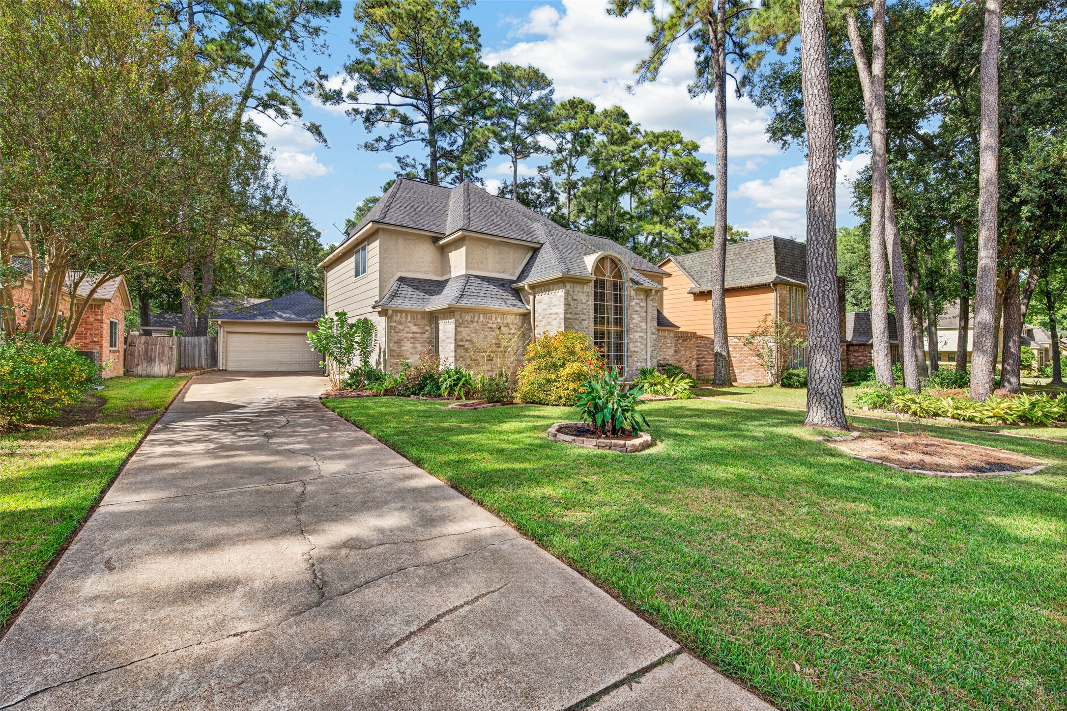 Well maintained 2-story home is nestled among mature trees and lush landscaping and has a sprinkler system for low maintenance living.