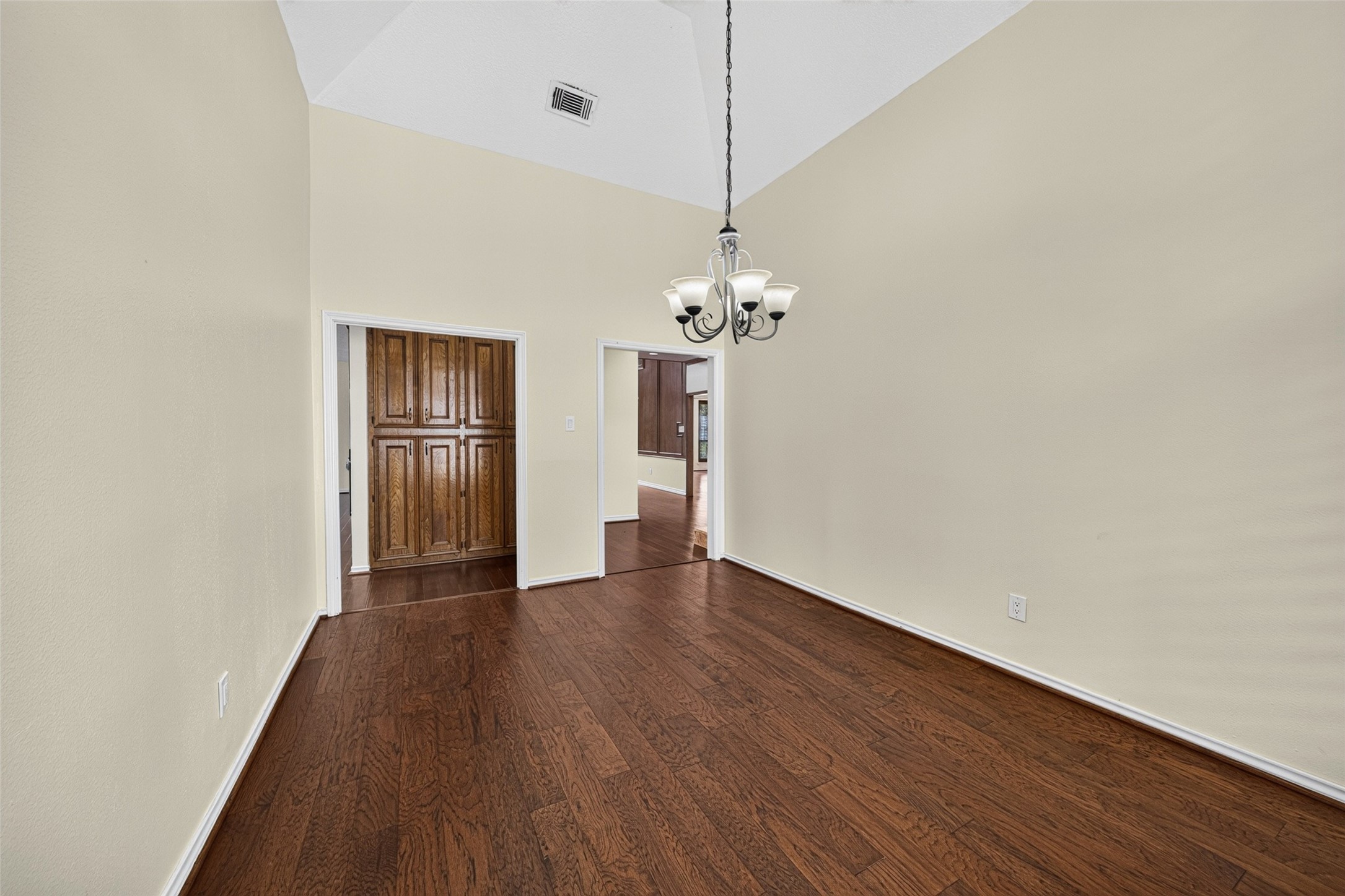 From this angle of the dining room you can see the additional storage off of the kitchen and the doorway on the right leads to the wine cellar.